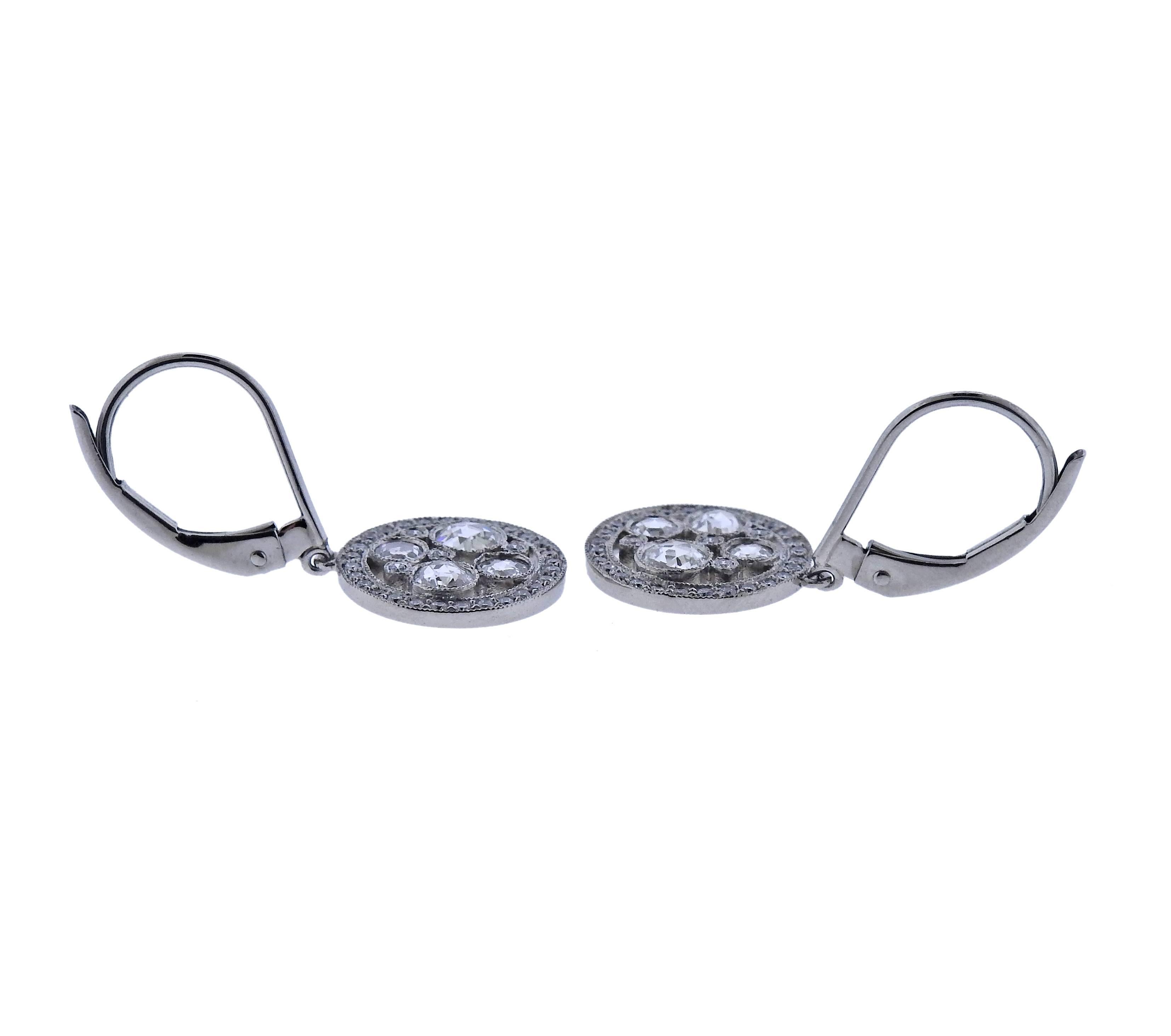 Pair of delicate Cobblestone platinum earrings, set with a total of 0.22ctw in round and rose cut diamonds. Crafted by Tiffany & Co. Earrings are 25mm long with wire, bottoms are 11mm in diameter, weight is 3.9 grams. Marked T & Co, pt950.