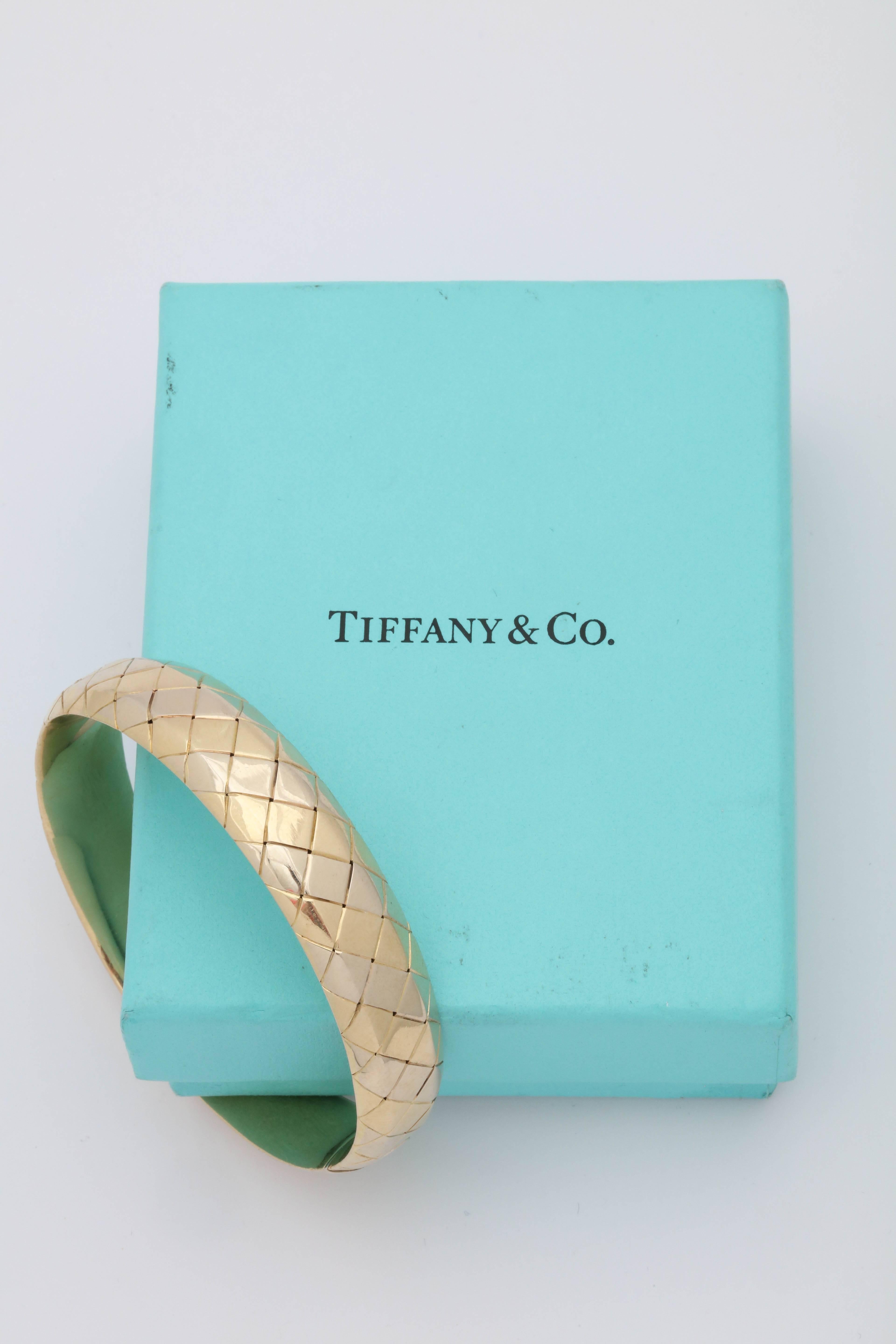 One Ladies Quilted Basket Weave Pattern With Invisible Easy Fastening And Closure Lock. Created In 18kt Yellow Gold This Bangle Bracelet Is Easily Worn With Any Attire. Made By Tiffany& Co. Italy And Created In The 1980's.