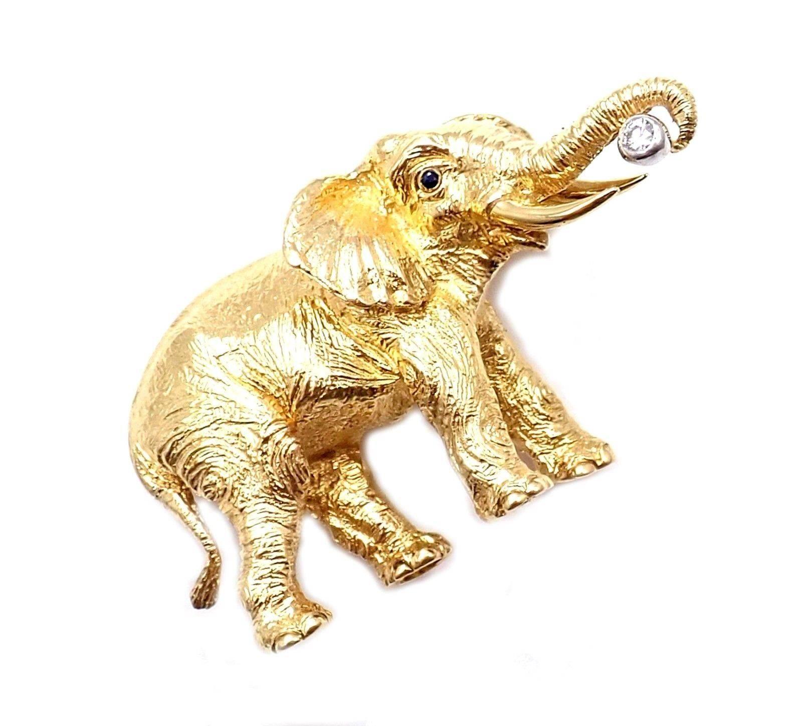 18k Yellow Gold Diamond Sapphire Elephant Brooch Pin by Tiffany & Co. 
With 1 round brilliant cut diamonds VS1 clarity, G color total weight approx. .05ct
2 sapphire eyes
Details: 
Measurements: 47mm x 27mm
Weight: 22.1 grams
Stamped Hallmarks: