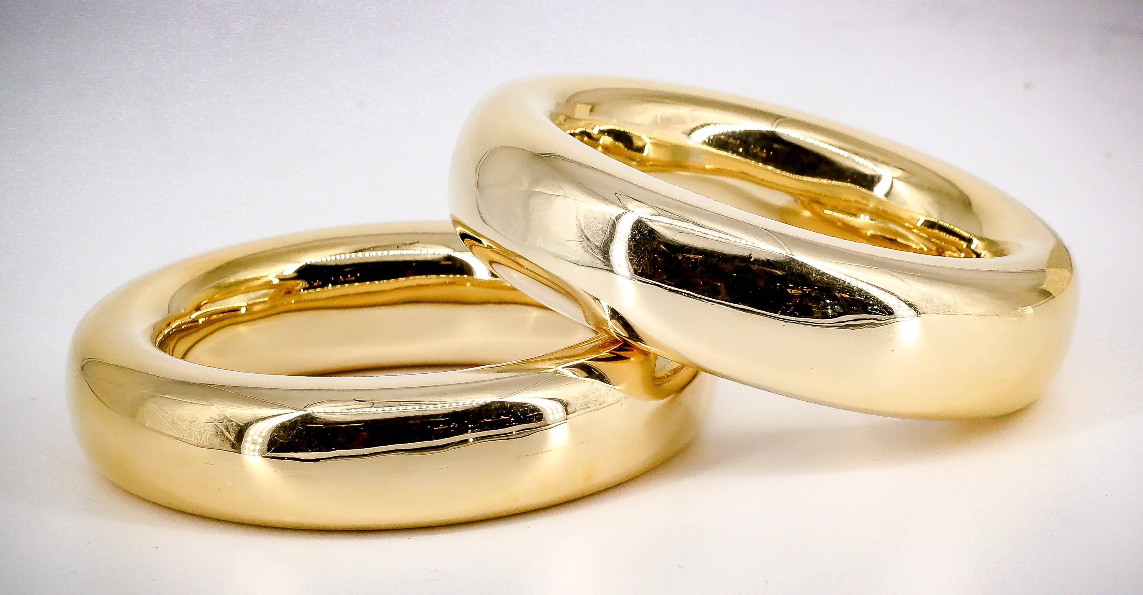 Bold pair of 18K gold bangle bracelets by Tiffany & Co. Elsa Peretti. One is marked 1981, while the other one is a recent make. Current retail price is $18000 for each, $36000 combined.

Hallmarks: 
1) Tiffany & Co. Elsa Peretti, 750 Italy
2)