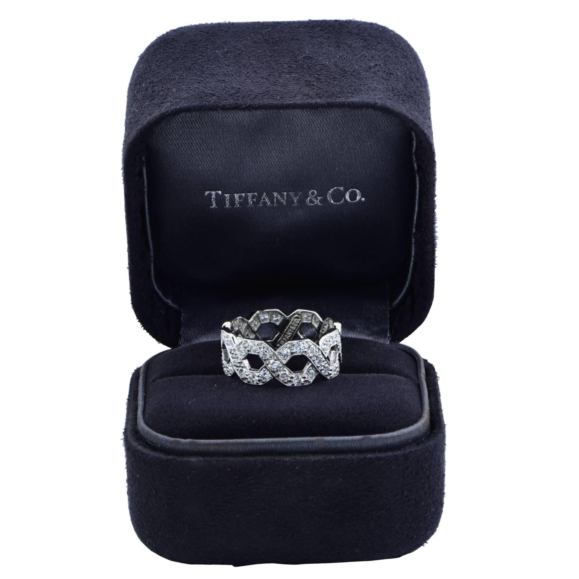 Tiffany & Co. Hexagonal Link diamond ring crafted in Platinum featuring 56 Round brilliant cut diamonds weighing approximately 1.70 carats total, F color, VVS-VS clarity, set in a hexagonal design. This elegant ring is a size 5.75 and measures 7.6