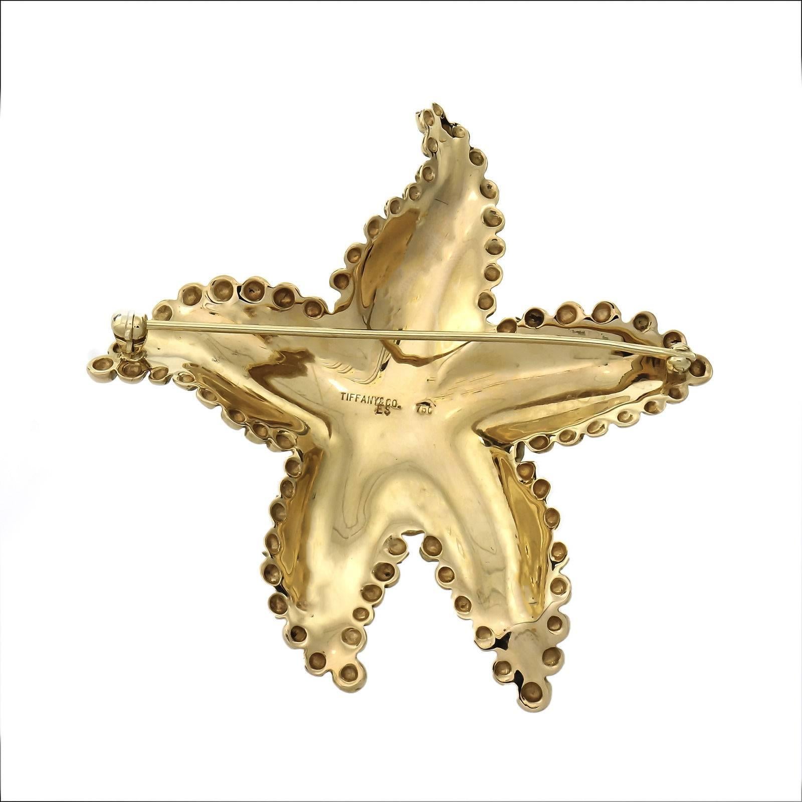 Tiffany & Co 1970’s large textured Star Fish brooch in solid 18k yellow gold. 

18k yellow gold
Top to bottom: 64.75mm or 2.55 inches
Width: 62.55mm or 2.46 inches
Depth: 6.18mm
27.8 grams
Tested: 18k
Stamped: 750
Hallmark: Tiffany & Co