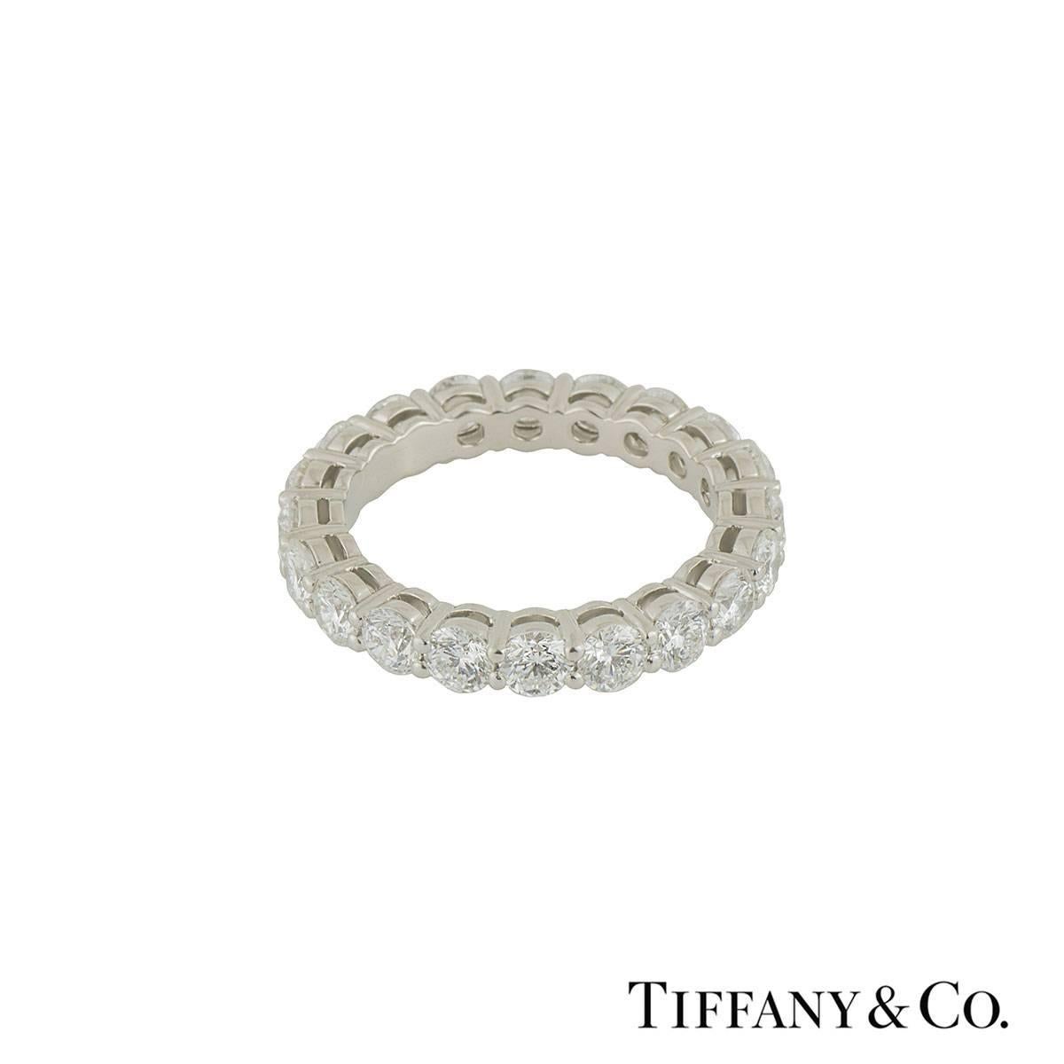A sparkly platinum Tiffany & Co. full diamond eternity ring from the Embrace collection. The ring comprises of 20 round brilliant cut diamonds in a shared prong setting with a total weight of 3.18ct, F+ colour and VS+ clarity. The ring measures