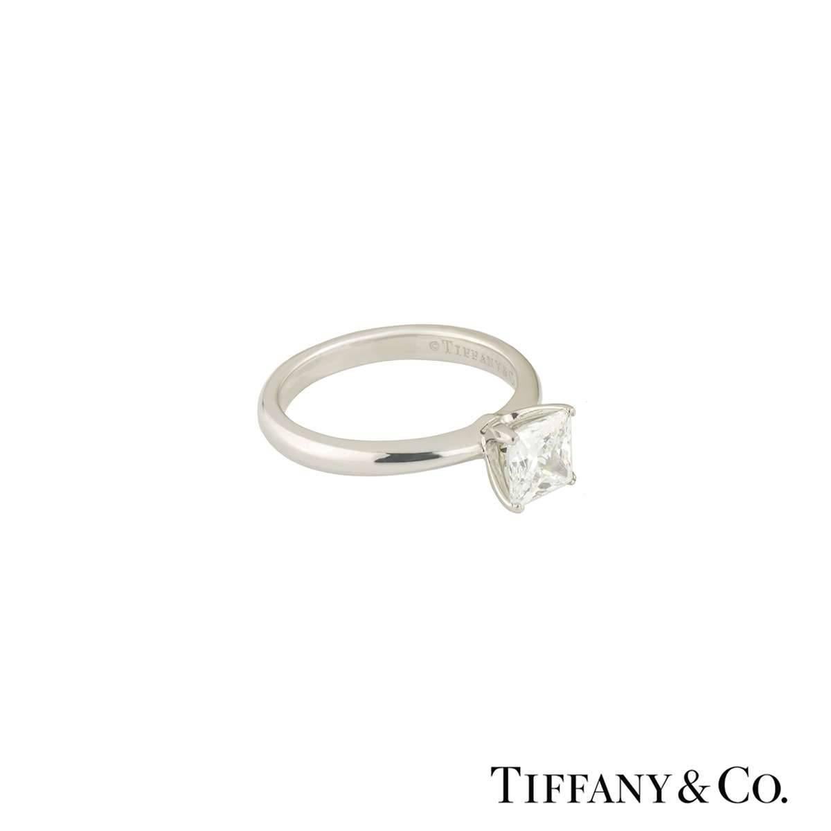 A beautiful platinum diamond Tiffany & Co. ring from the princess cut collection. The ring comprises of a princess cut diamond in a 4 claw setting with a total weight of 1.05ct, G colour and VVS2 clarity. The ring is set in a court fit band and is a