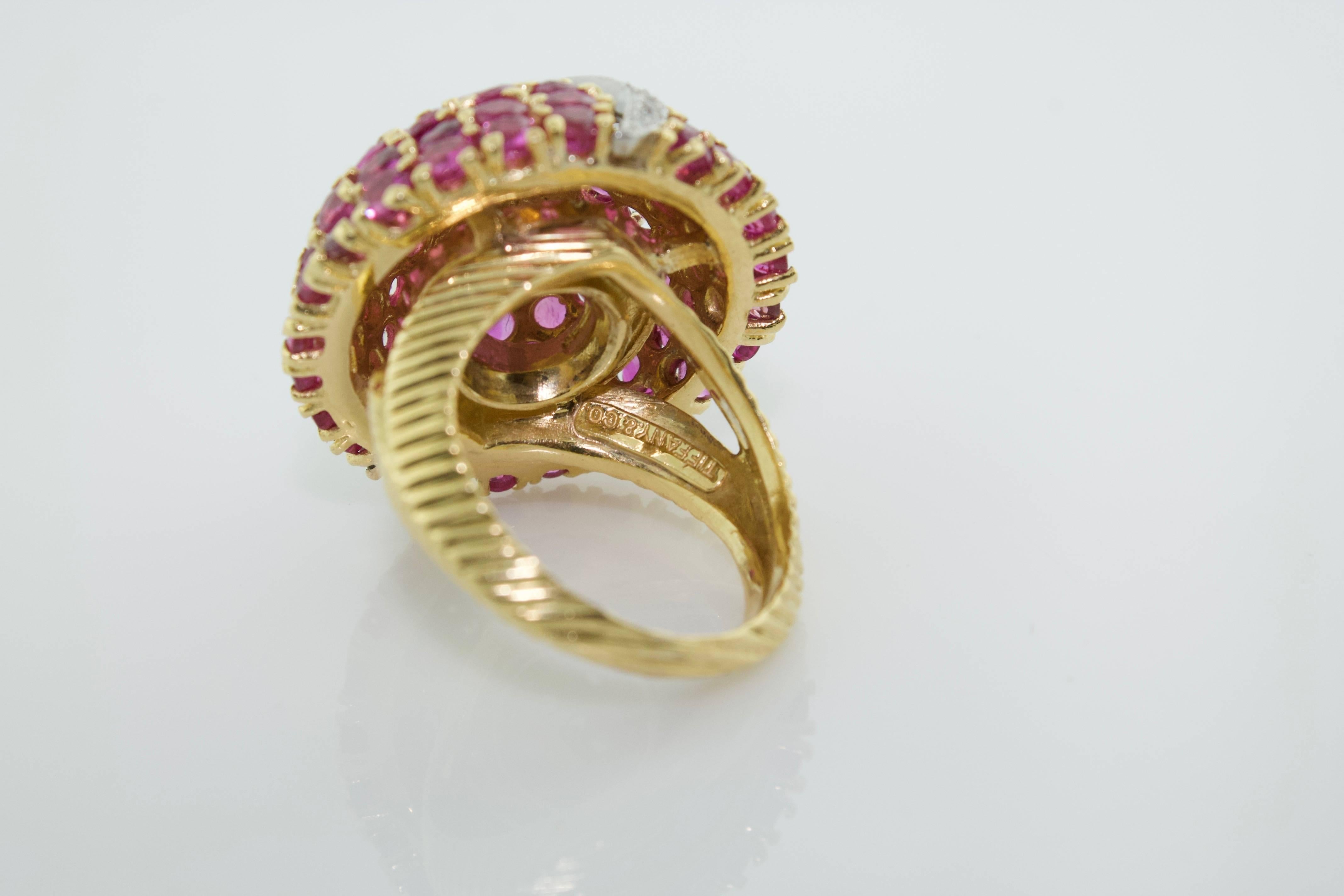 Tiffany & Co. Ruby and Diamond Dome Ring Circa 1940's
.55 in Round Diamonds Color GH Clarity VVS-SI1
6.00 Carats of Round Rubies in 18 Carat Yellow Gold
Ring Size 6.5 Purchased From a Renowned Hollywood Family Who Stipulated That They Remain