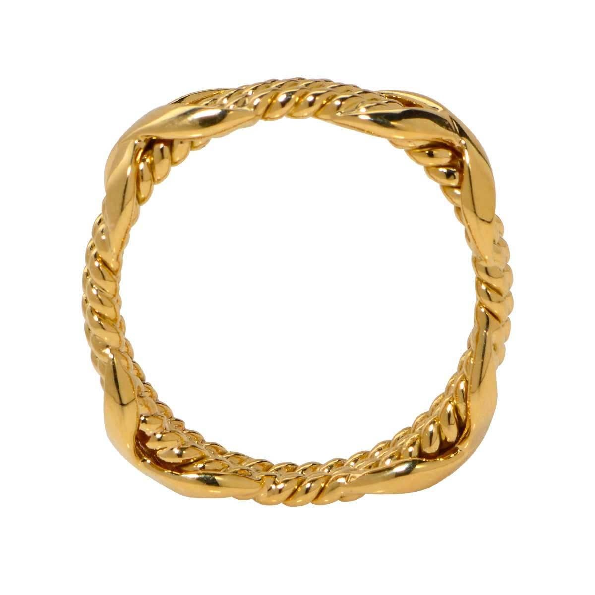 Tiffany & Co. Schlumberger Rope Three-row X Ring expertly crafted in 18k Yellow Gold. It is a size 5 and measures 6.26mm at its widest part. Since 1956 Jean Schlumberger has collaborated with Tiffany & Co. to create some of the worlds most coveted