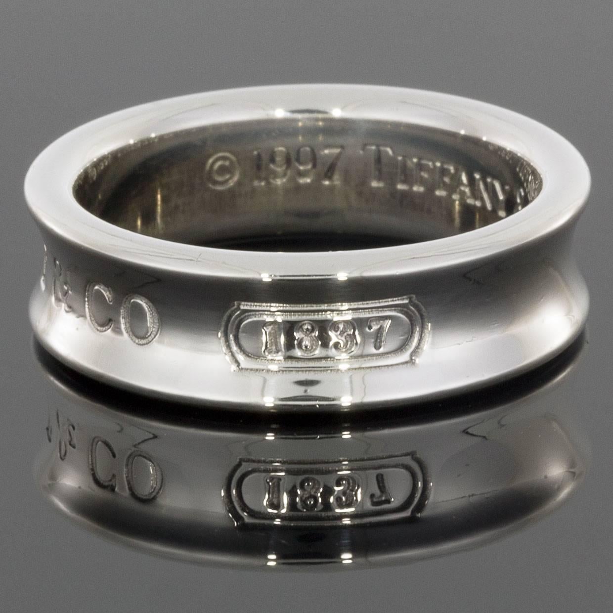 Tiffany & Co jewelry has long been admired for its quality and beauty, and this mens' wedding band is no exception. The band is engraved with the year and location Tiffany was founded — 
