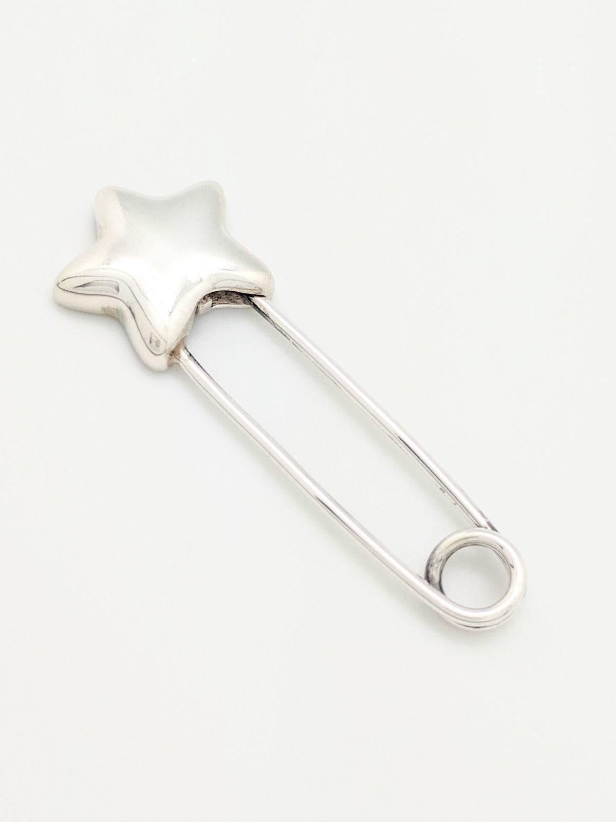 Authentic Tiffany & Co Sterling Silver STAR Diaper Safety Pin Brooch with Pouch

You are viewing an Authentic Tiffany Co. STAR Diaper Safety Pin/Brooch. This piece is crafted from sterling silver and weighs 12.1 grams. The pin/brooch measures 3 1/4
