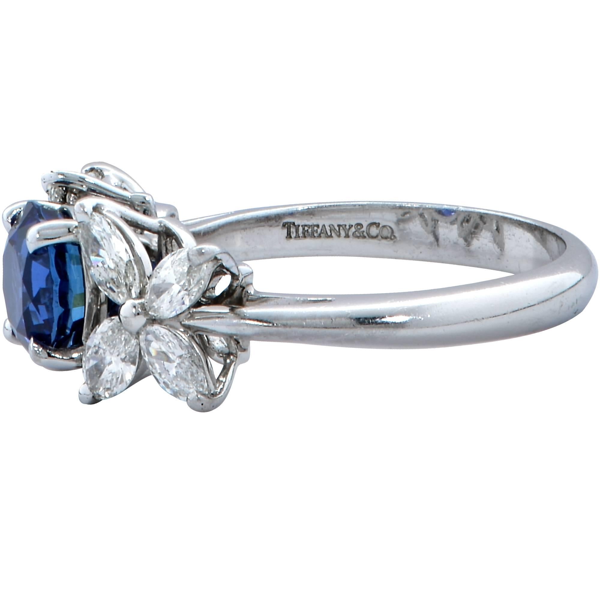 This beautiful and seductive Tiffany & Co. Victoria collection ring features a round blue sapphire gemstone which is accented by the iconic Victoria diamond flower motif.

The ring is a size 6 and CANNOT be sized up or down.
Measurements are