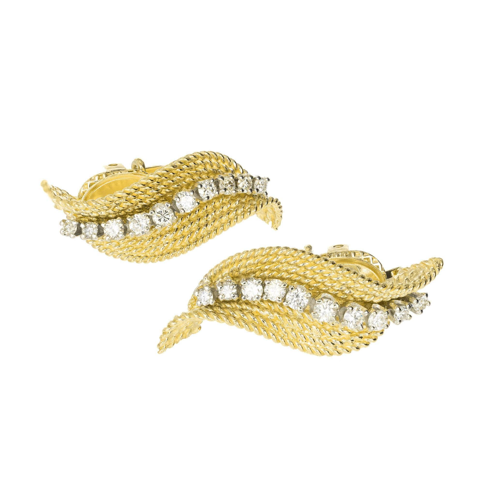 1950s Tiffany & Co 18k yellow and white gold patented adjustable clip and post swirl diamond earrings. 

20 round diamonds, approx. total weight .70cts, F – G, VS
18k yellow and white gold
12.2 grams
Tested and stamped: 18k
Hallmark: Tiffany & Co