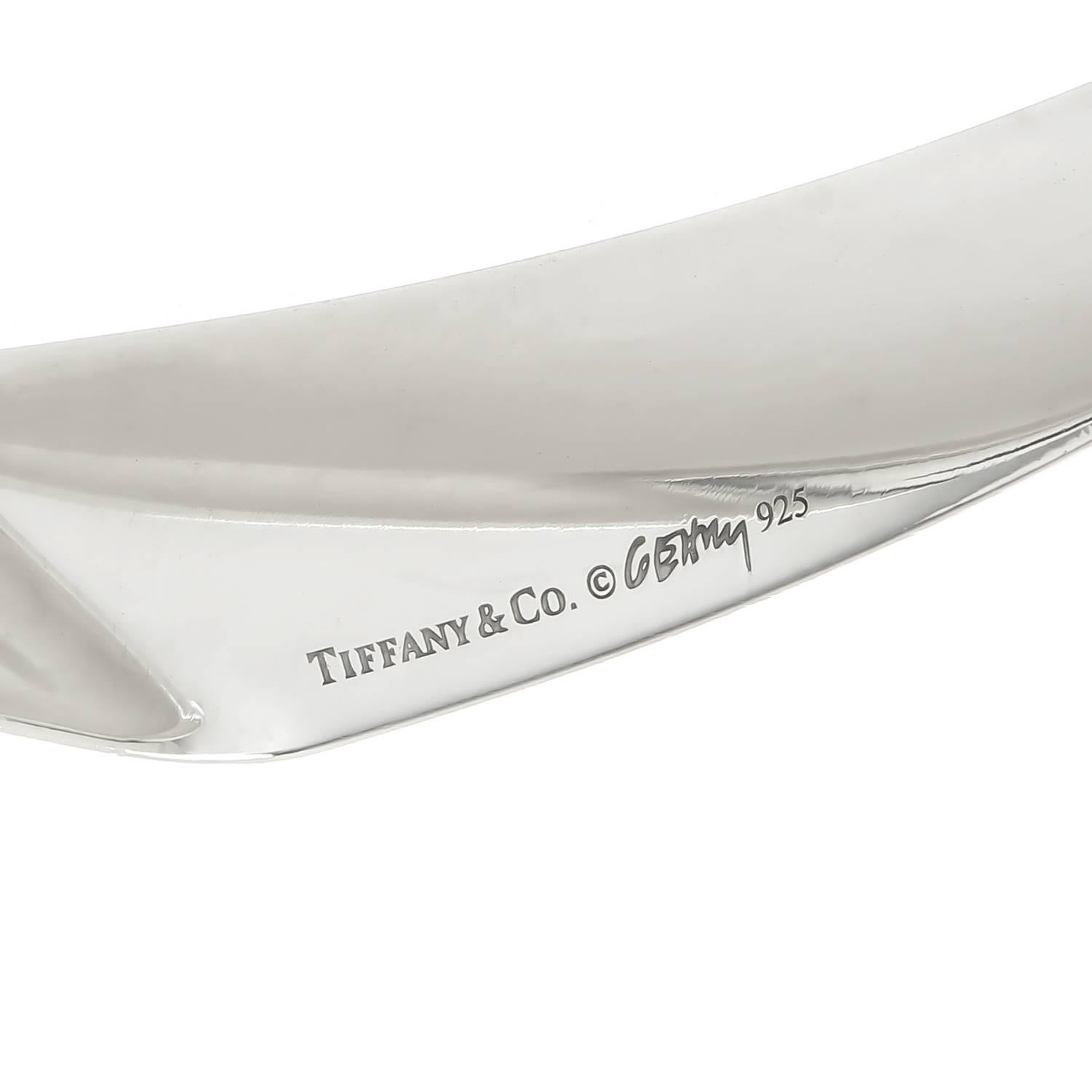Circa 2010 Frank Gehry for Tiffany & Company Sterling Silver Bangle Bracelet, measuring 1/2 inch wide and having a wrist measurement of 8 Inches. Excellent condition and comes in Tiffany Suede pouch.