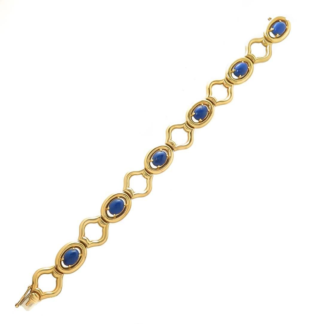 Circa 1970s Tiffany & Company 18K Yellow Gold Bracelet, measuring 7 inches in length and 1/2 inch wide. Set with fine color Lapis Lazuli Ovals each measuring 7 X 5.5 M.M.