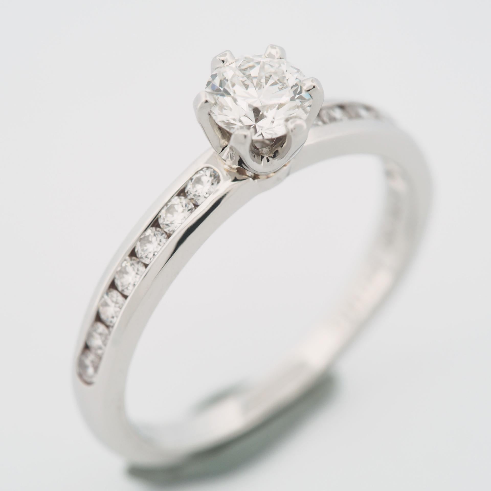 Round Cut Tiffany 0.38 Carat Solitaire Diamond Ring PT950 with Channel Set Diamonds For Sale