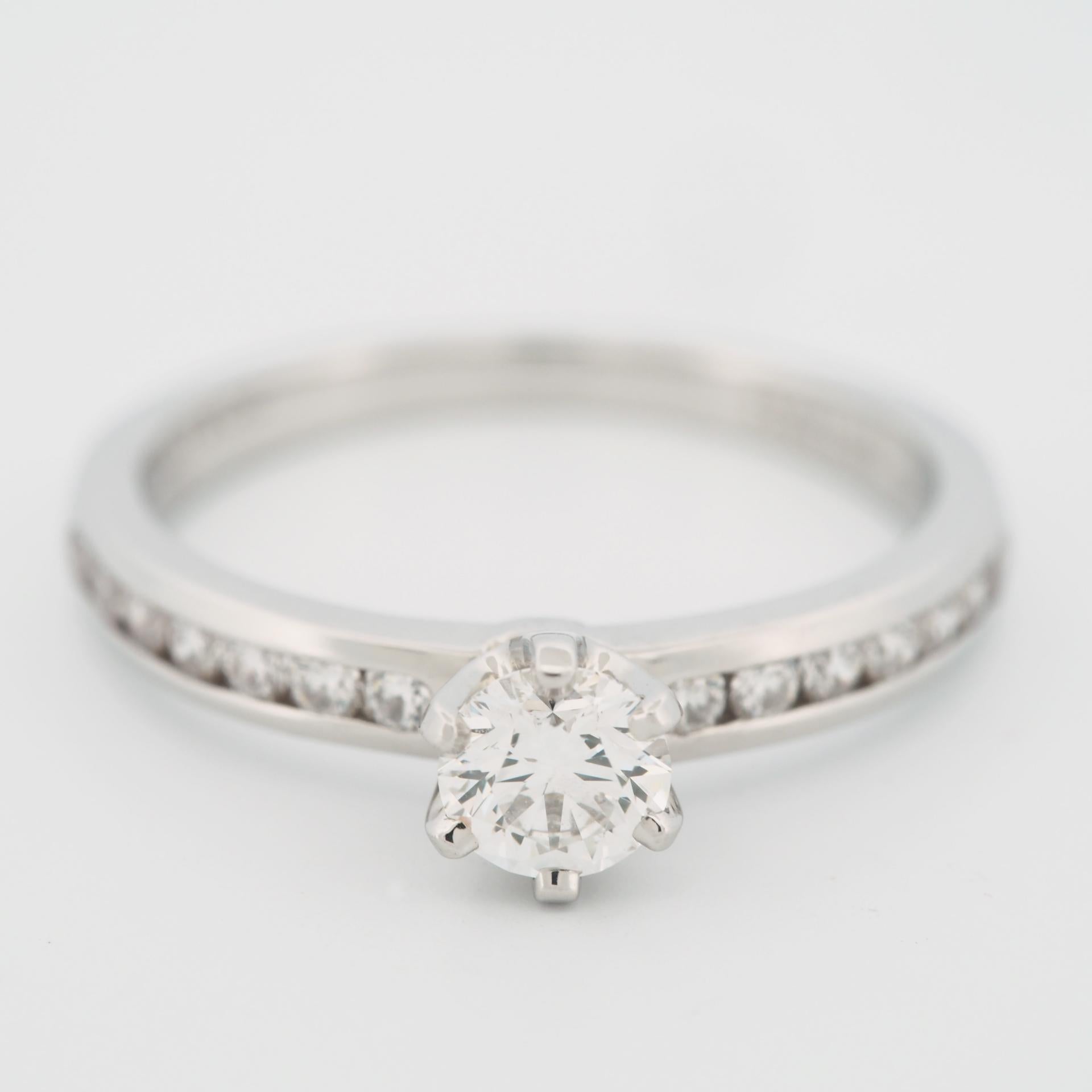 Round Cut Tiffany 0.38 Carat Solitaire Diamond Ring PT950 with Channel Set Diamonds For Sale