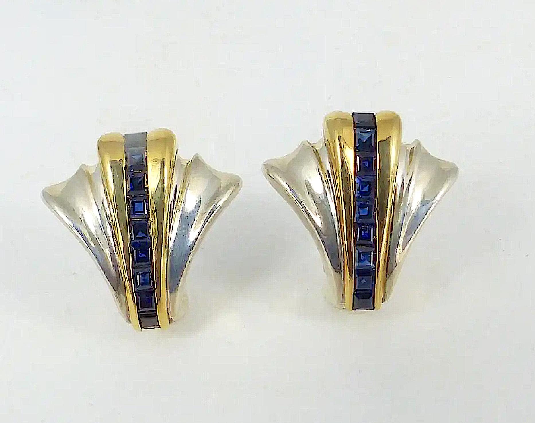 Stunning Art Deco Style Tiffany & Co. Sterling Silver, 14 Kt. yellow gold and Sapphire Fan Form Earrings.
A lovely pair of earrings by Tiffany  & Company crafted of sterling silver having an Art Deco style fan design and featuring 18 emerald cut