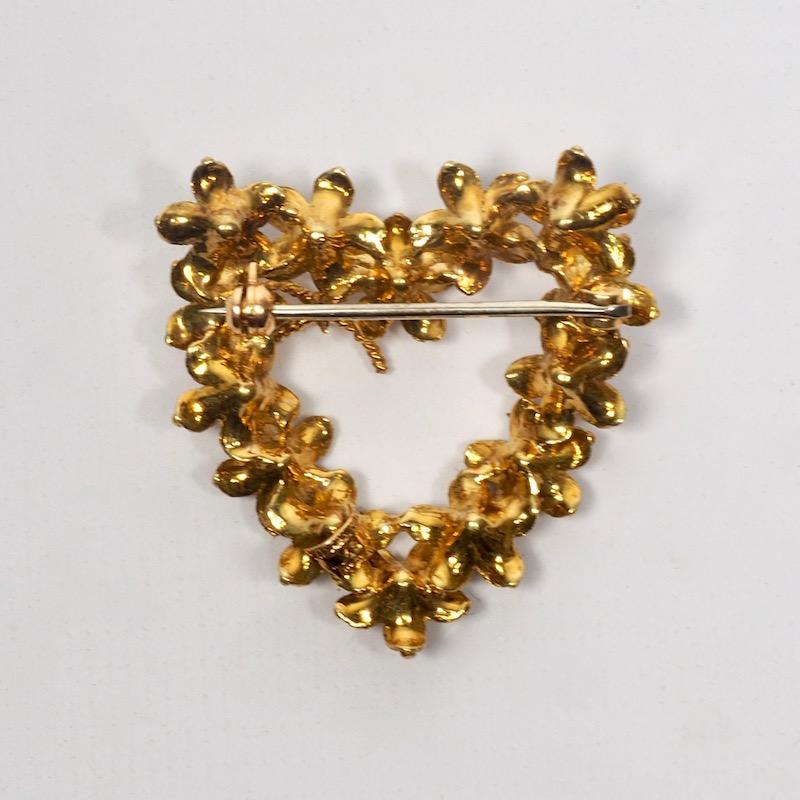 Tiffany 18 Karat Gold Floral Heart Brooch of delicately modelled flowers surmounted with a bow. Stamped Tiffany Italy 18K to back. 7.7 dwt. 
