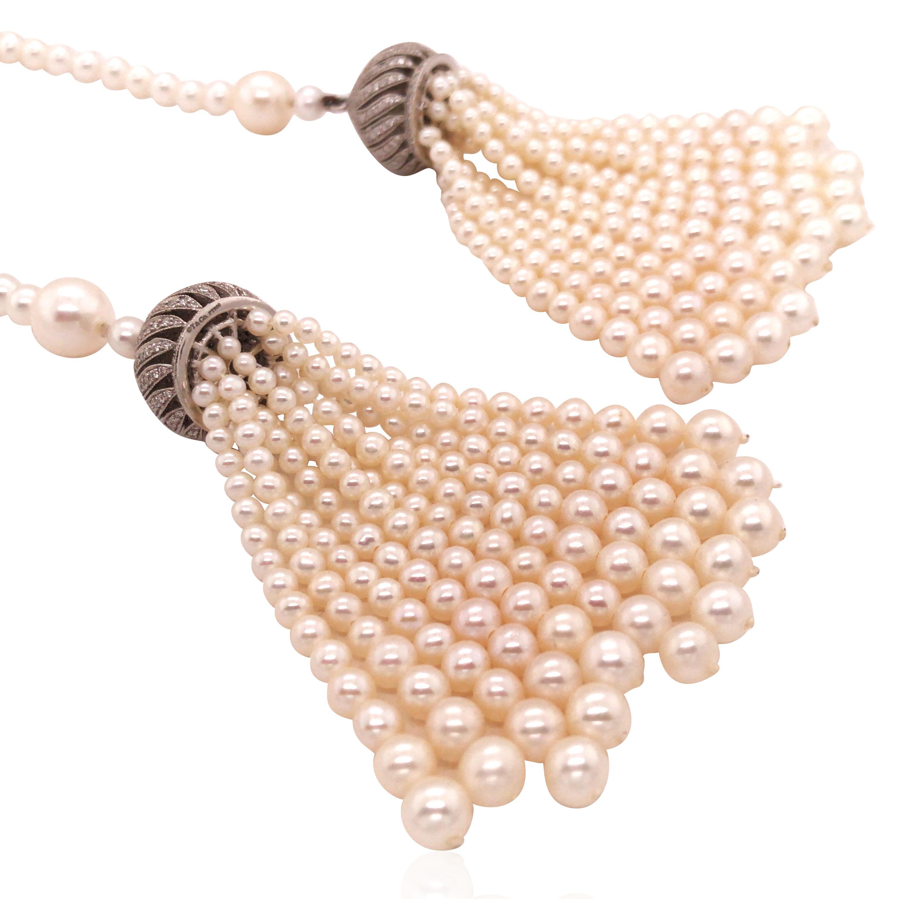 Freshwater strand with saltwater cultured pearl tassel pendant, enhanced with round diamonds total approx. 1.5ct. 

Measurement: 132.1cm in length