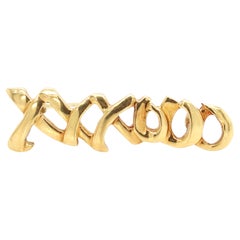 Tiffany, Spilla 'XXXOOO' in oro 18 carati
