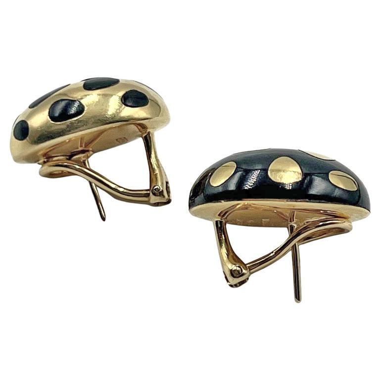 1980s oval dome shape earrings in 18k yellow gold inset with black jade to create a positive/negative design. French style hinged clip backs with pierced posts. Underside marked “Tiffany & Co. 750 Hong Kong”.

This is an original design of Angela