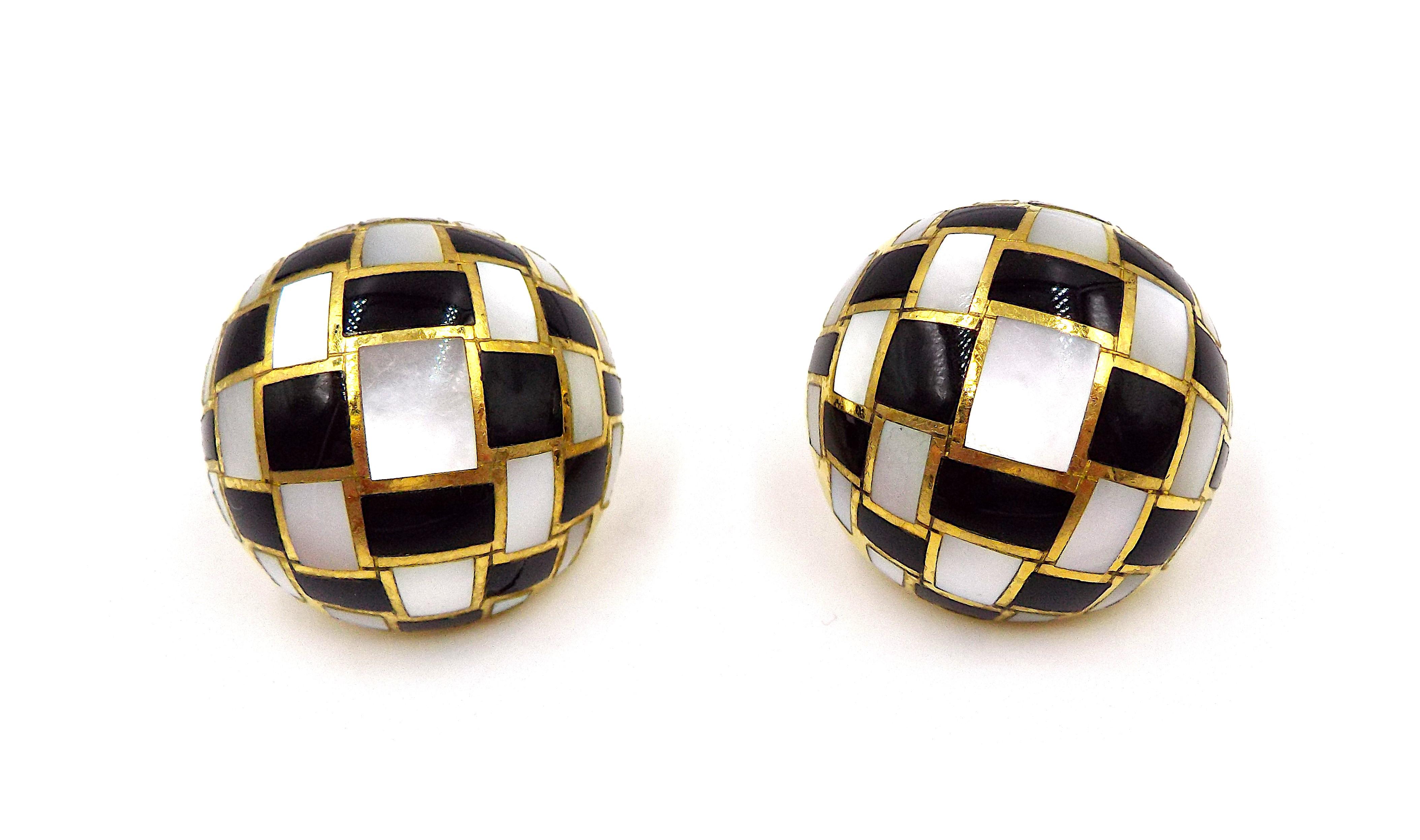 A pair of stylish dome-shaped earrings by Tiffany. 18K yellow gold, onyx and mother-of-pearl chessboard pattern, signed Tiffany, stamped 750. Each earring weighs 11.4 grams, diameter is 1 inch. The earrings are designed for pierced ears.