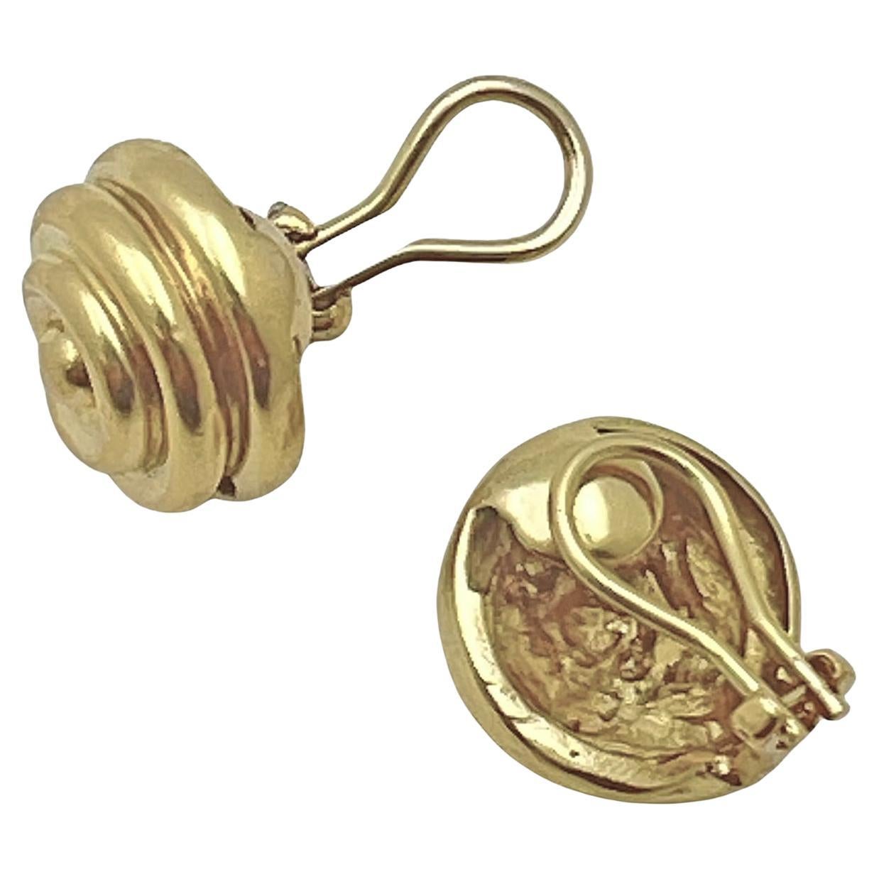 18k yellow gold spiral clip earrings by Tiffany & Co.  Raised spiral design with polished finish.  Clip-style omega backs.  Signed “Tiffany & Co. 18k”.   Circa 1990.  0.64