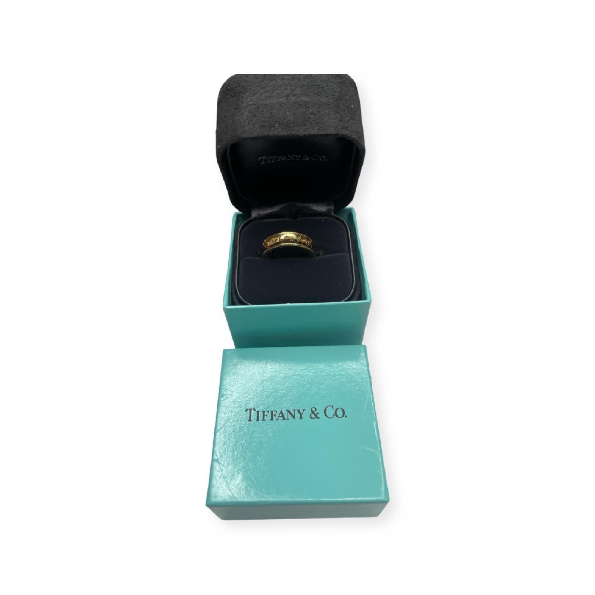 Tiffany 18K Yellow Gold Wedding Band 1897.  This ring is 6.0 mm in width. It is in excellent condition. It comes with the original Tiffany box. It is finger size 7.