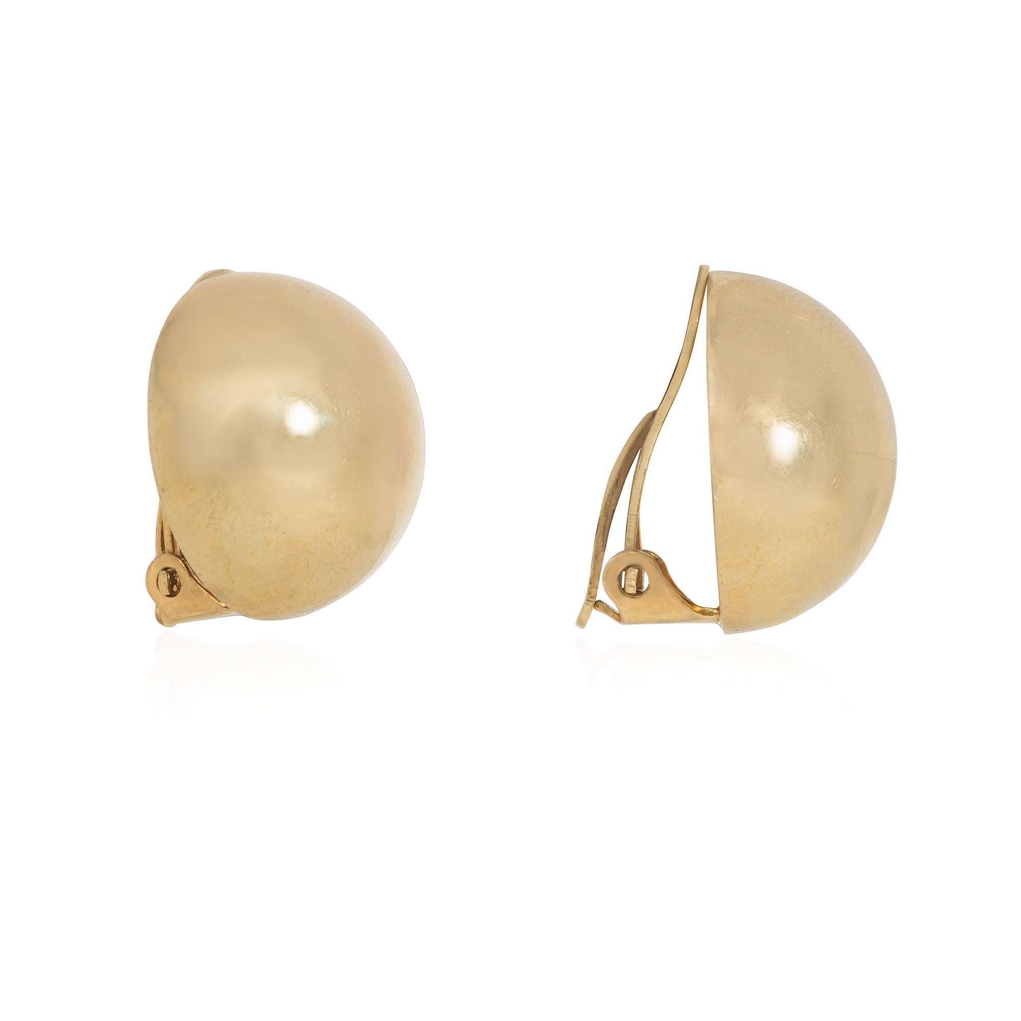 A pair of Retro gold button earrings of domed design with clip backs, in 14k. Tiffany & Co.  A classic, tailored look that never goes out of style!


