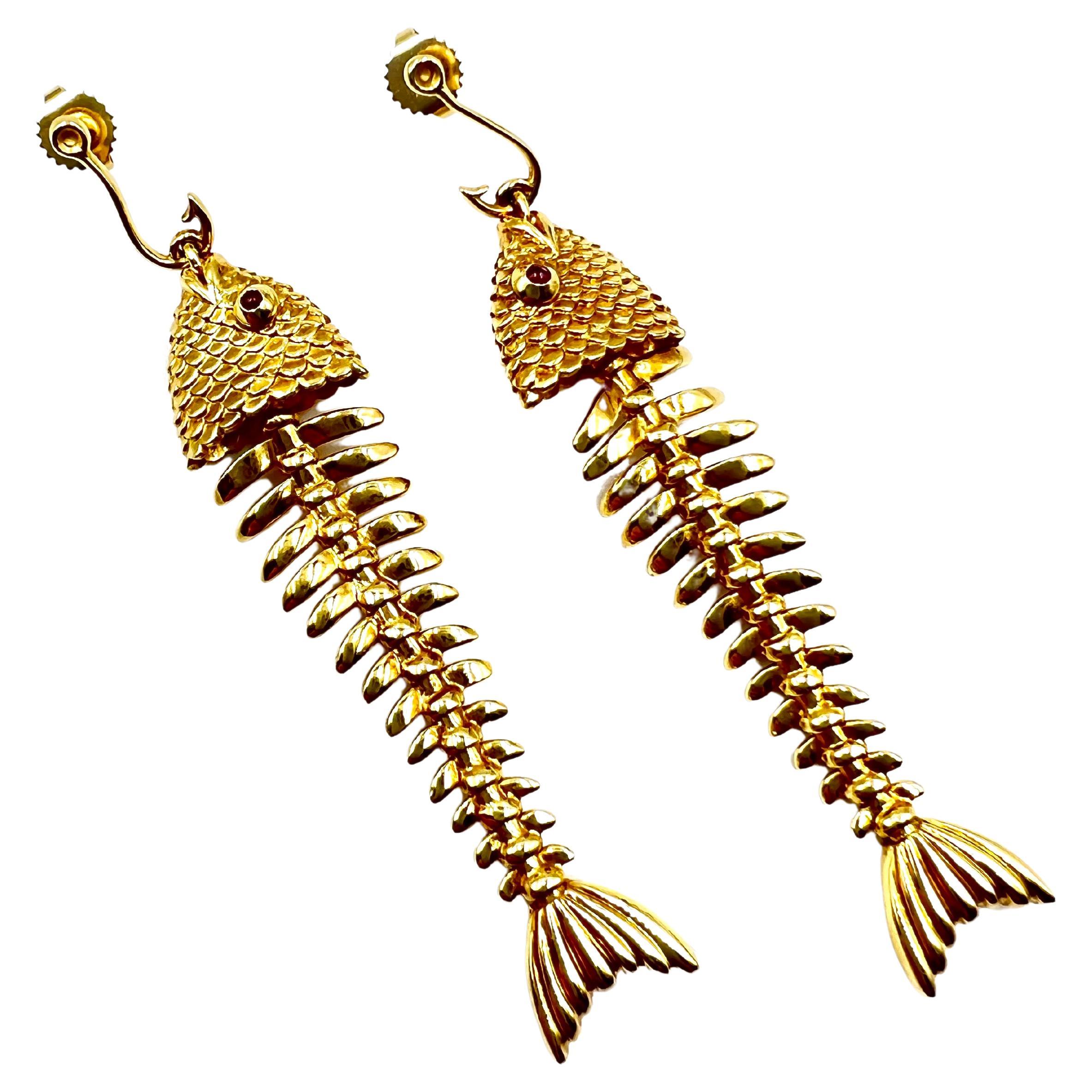 Tiffany & Co. 18kt yellow gold fish design, flexible drop style earrings measuring approximately 2.75