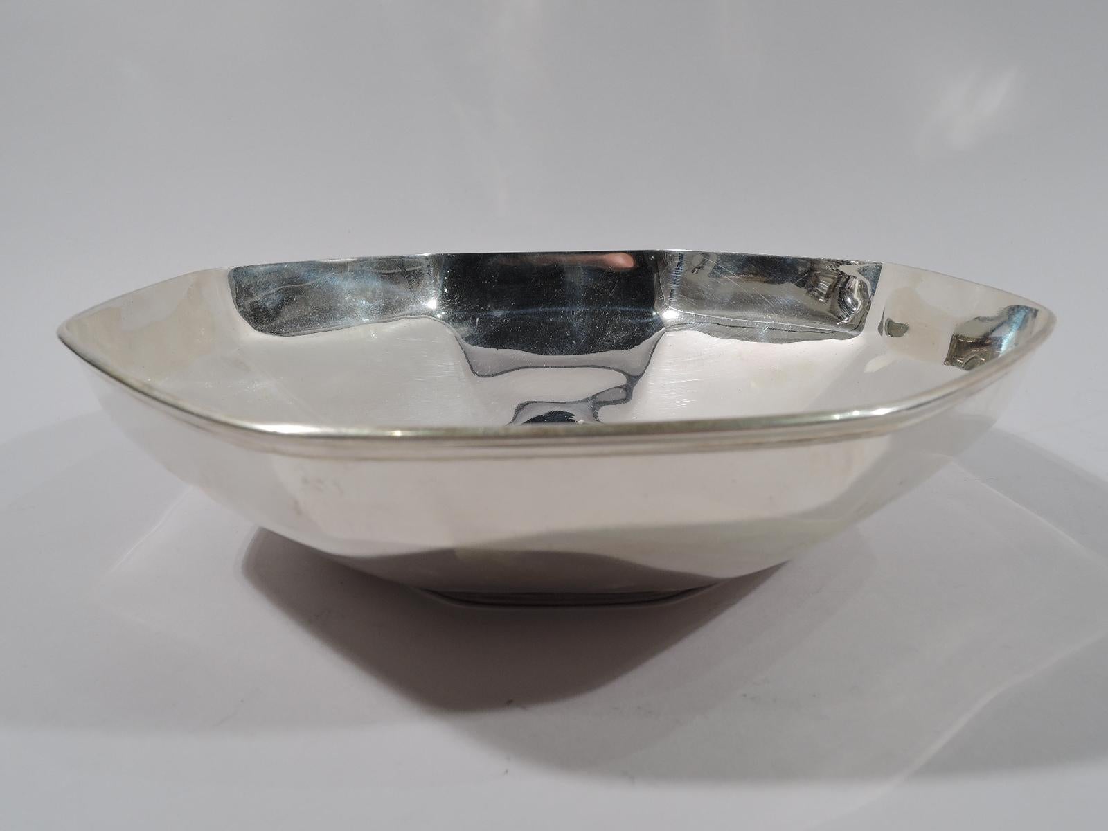 Art Deco sterling silver bowl. Made by Tiffany & Co., circa 1923. Octagonal with curved and tapering sides, and molded rim. A softened version of the geometric style. Fully marked including pattern no. 20200 (first produced in 1923) and director's