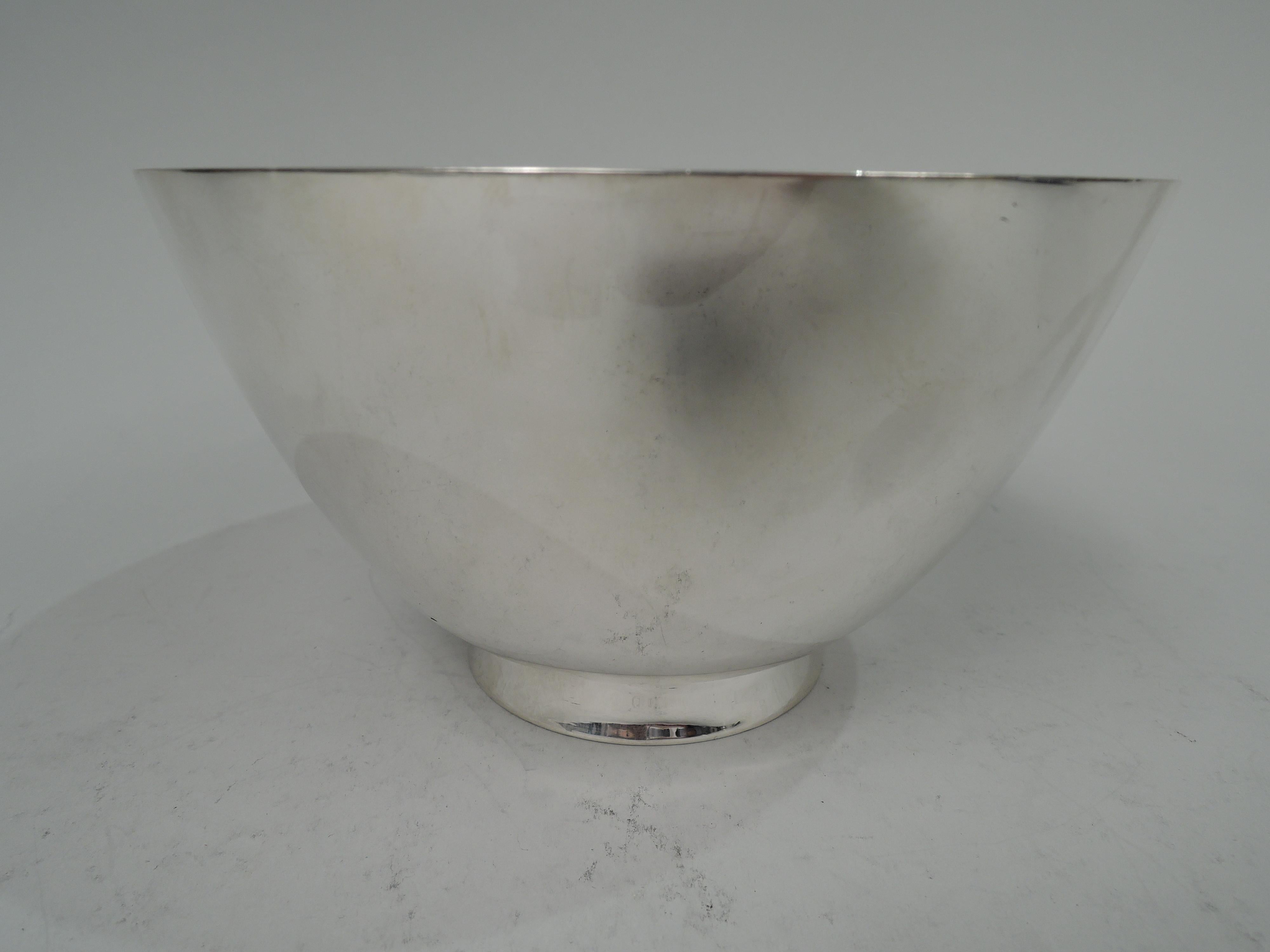 Art Deco sterling silver bowl. Made by Tiffany & Co. in New York. Curved and tapering sides; short and splayed foot. Fully marked including maker’s stamp, pattern no. 20024, and director’s letter M (1947-56). Weight: 11 troy ounces. 
