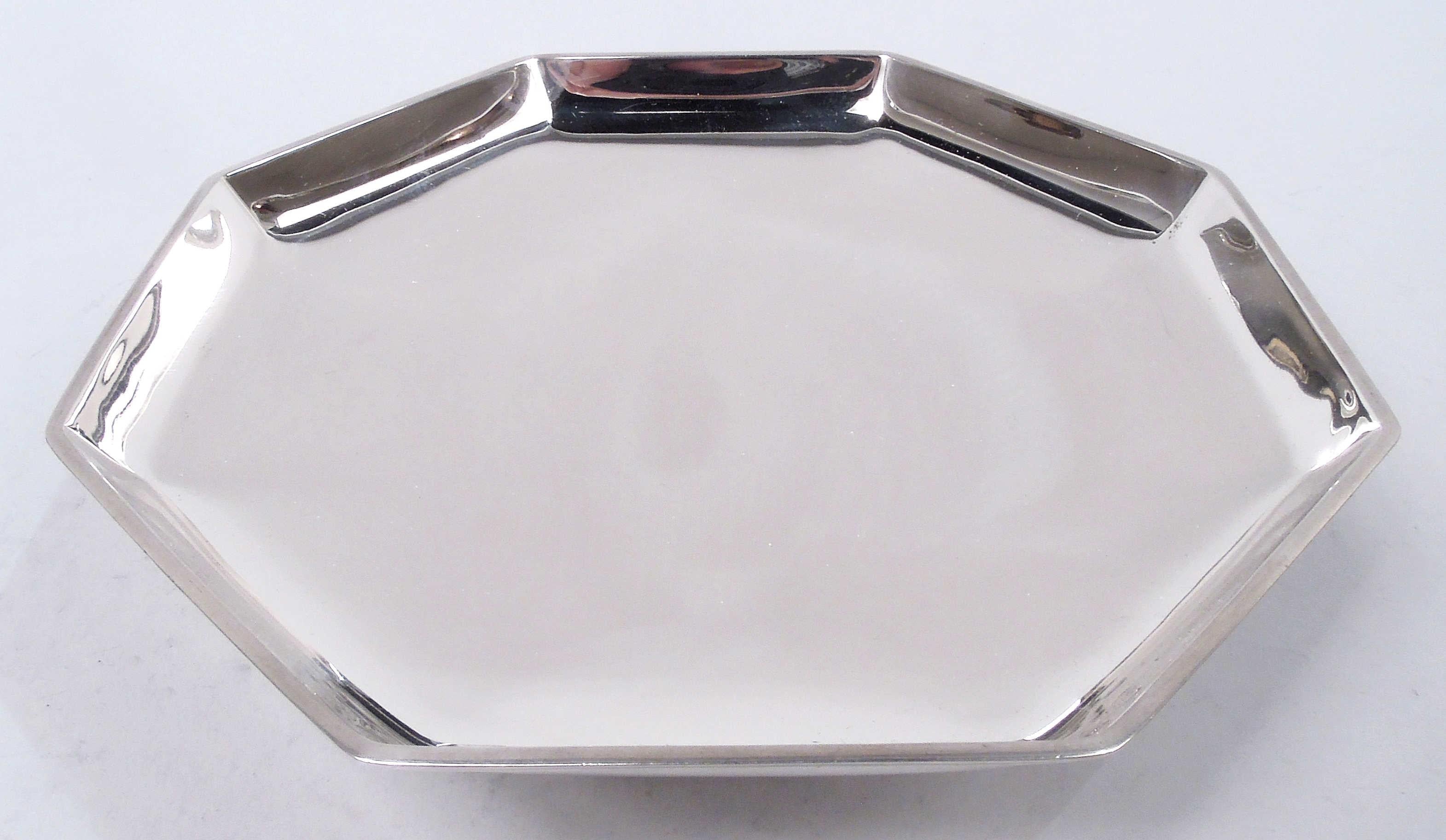 Art Deco sterling silver footed bowl. Made by Tiffany & Co. in New York, ca 1914. Shallow and octagonal with flat rim; raised and stepped support. Fully marked including maker’s stamp, pattern no. 18780 (first produced in 1914), and director’s