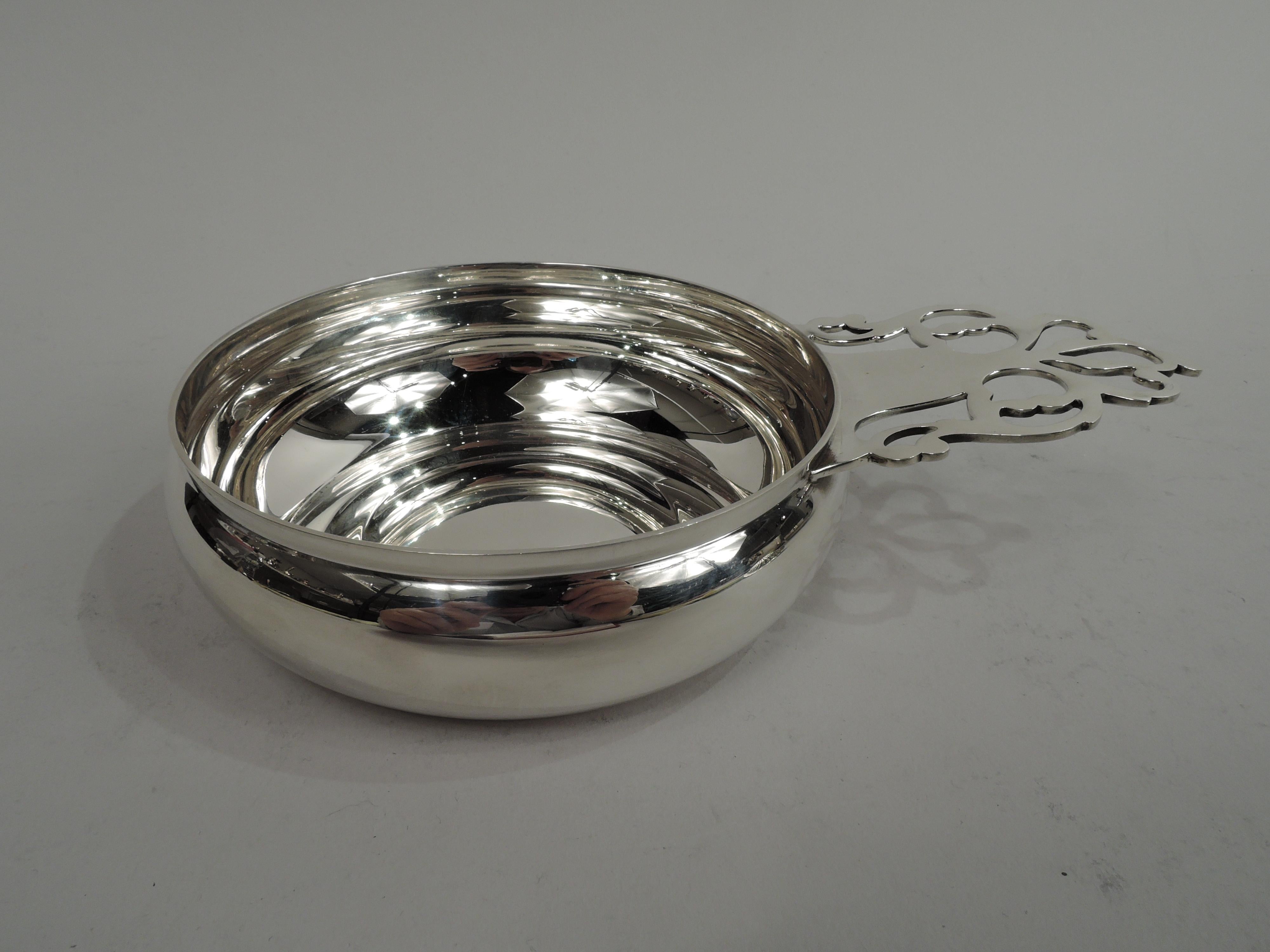 Colonial sterling silver porringer. Made by Tiffany & Co. in New York. Round and curved bowl with open tree handle. Traditional with room for engraving. Fully marked including maker’s stamp, pattern no. 19206, and director’s letter M (1947-56) as