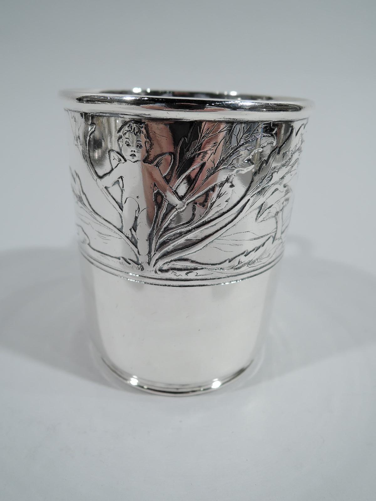 Edwardian Art Nouveau sterling silver baby cup. Made by Tiffany & Co. in New York, ca 1910. Straight sides, short inset foot, and c-scroll handle. Slightly hallucinatory acid-etched frieze with cherubs frolicking amidst aquatic foliage and giant