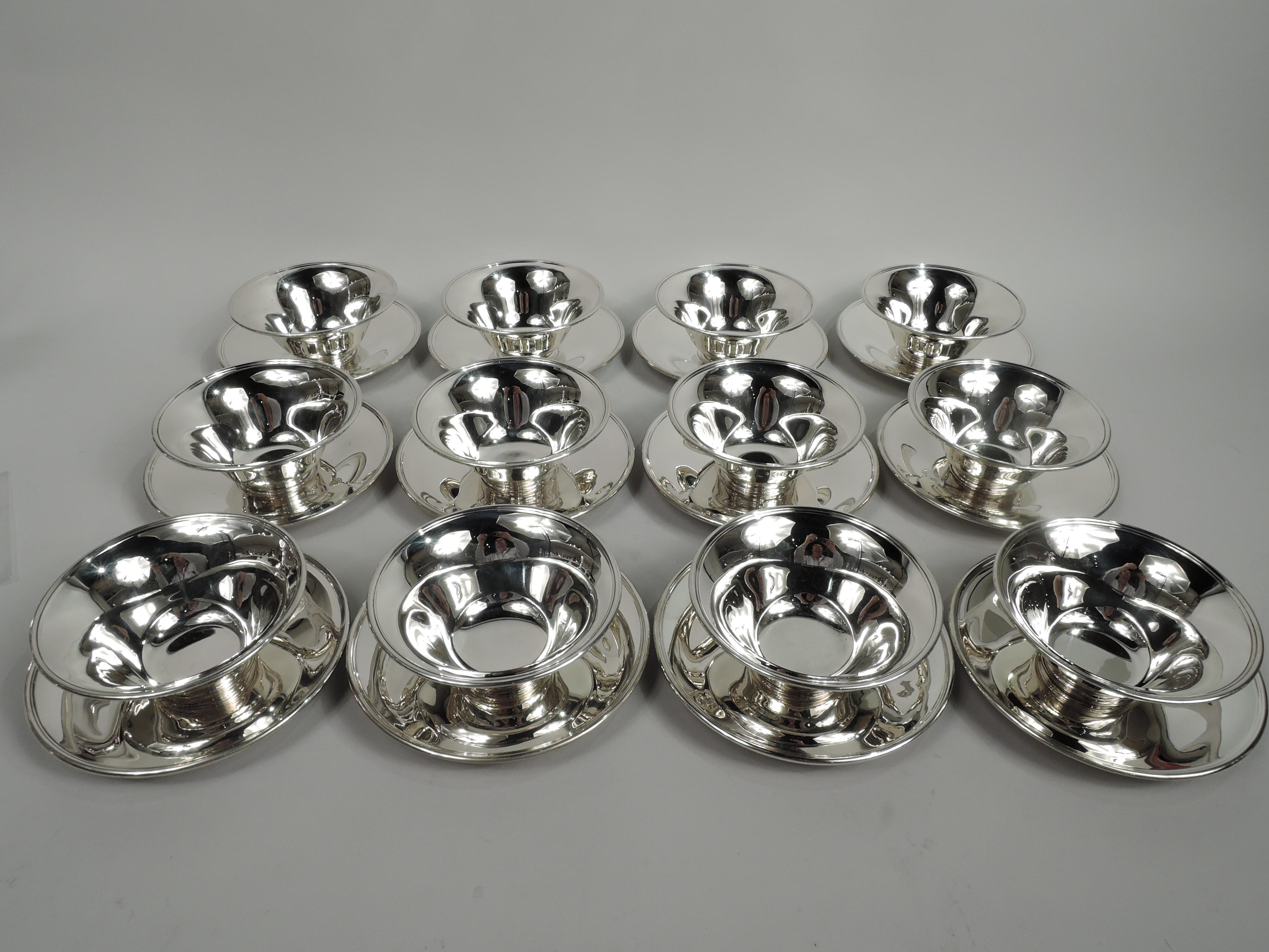 Set of 12 Modern sterling silver dessert sets. Made by Tiffany & Co. in New York, ca 1912. Each bowl: Tapering sides with flared rim and curved bottom; short and stepped foot. Each plate: Circular well with wide and tapering shoulder. Fluid and