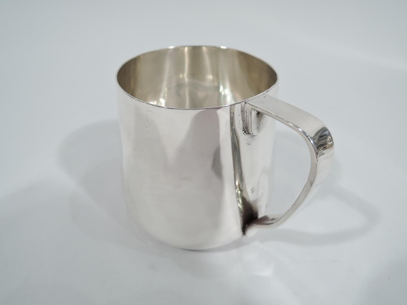 American Modern sterling silver baby cup. Made by Tiffany & Co. in New York. Upward tapering sides and scroll bracket handle. Lots of room for engraving. Fully marked including pattern no. 20272. Weight: 2.8 troy ounces.