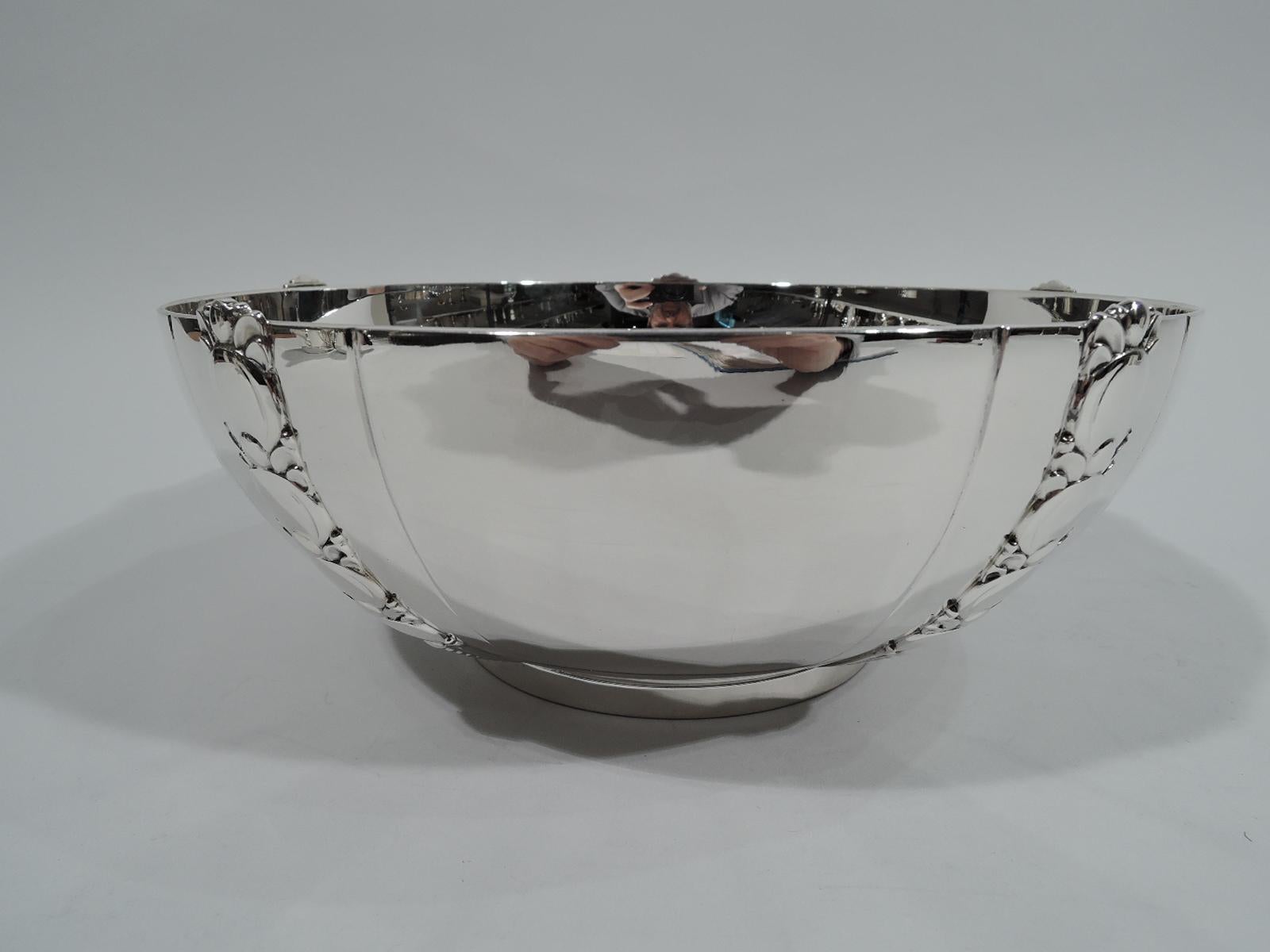 Modern sterling silver tomato serving bowl. Made by Tiffany & Co. in New York. Curved sides and short and straight foot ring. Vertical pilasters comprising graduated and stylized tomatoes applied to bowl exterior between incised bands. Fully marked