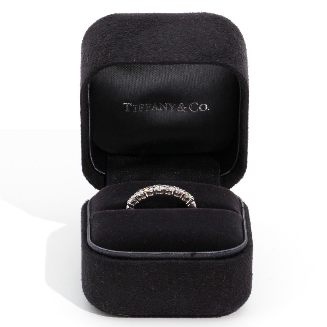 Platinum Tiffany and Co Diamond Embrace Ring has an estimated total of  0.63 carats of sparkling round brilliant cut diamonds. Platinum Tiffany and Co Diamond Embrace Ring is accompanied with the original signature Tiffany and Co navy ring box and