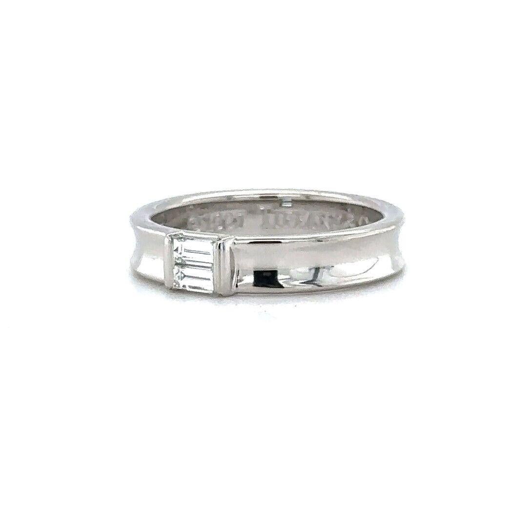 Tiffany and Co. 1997 18k White Gold Baguette Diamond Wedding Band Size 7.5

Condition:  Excellent Condition, Professionally Cleaned and Polished
Metal:  18k Gold (Marked, and Professionally Tested)
Weight:  6.2g
Diamonds:  Two Baguette Cut Diamonds