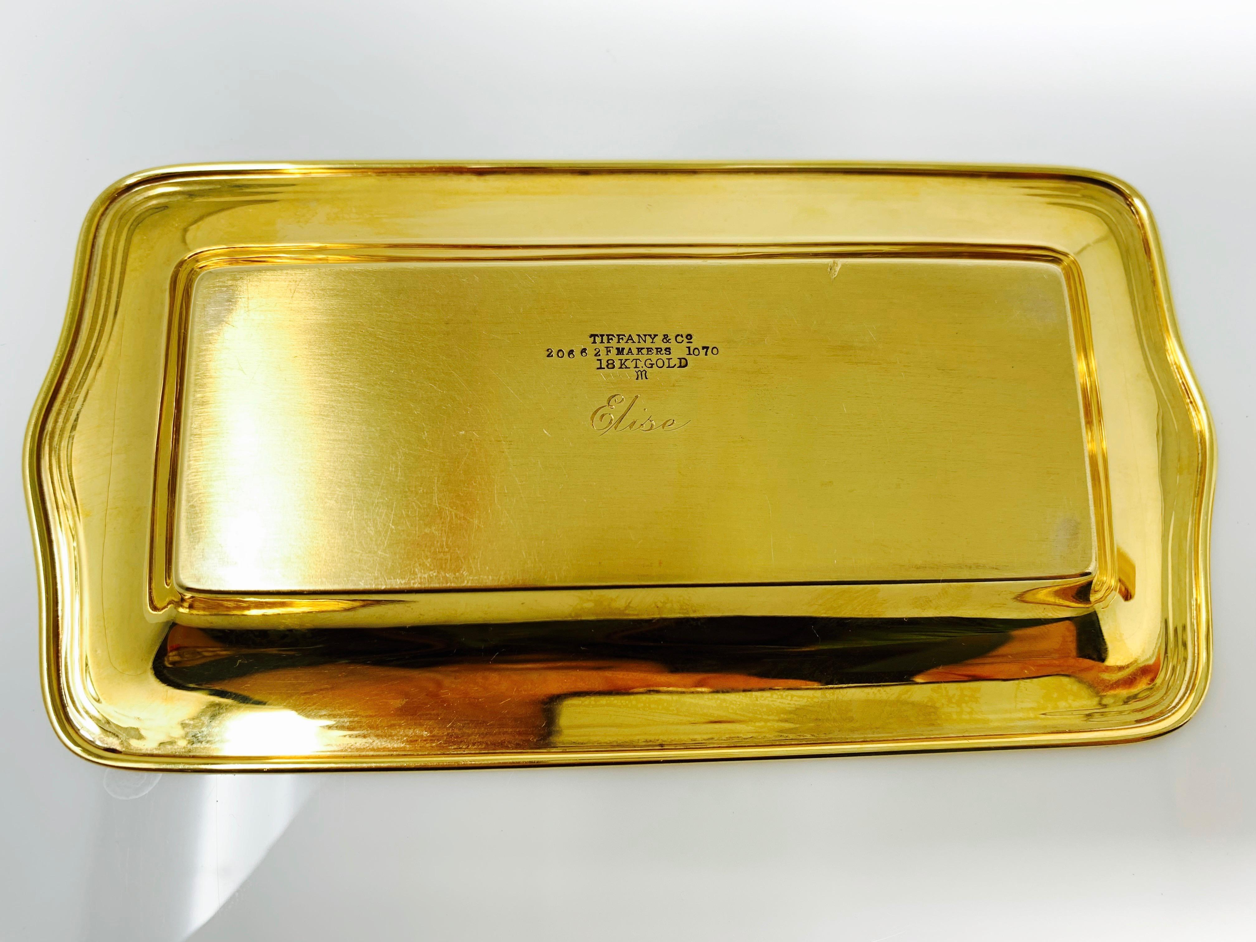 This is a Tiffany and co 18 karat gold tray. It is beautiful and can be used as the center piece for decoration purposes. The tray has a tiffany and co stamp on it. 
Measurements : Length : 5 1/2 inches 
                            width :   3