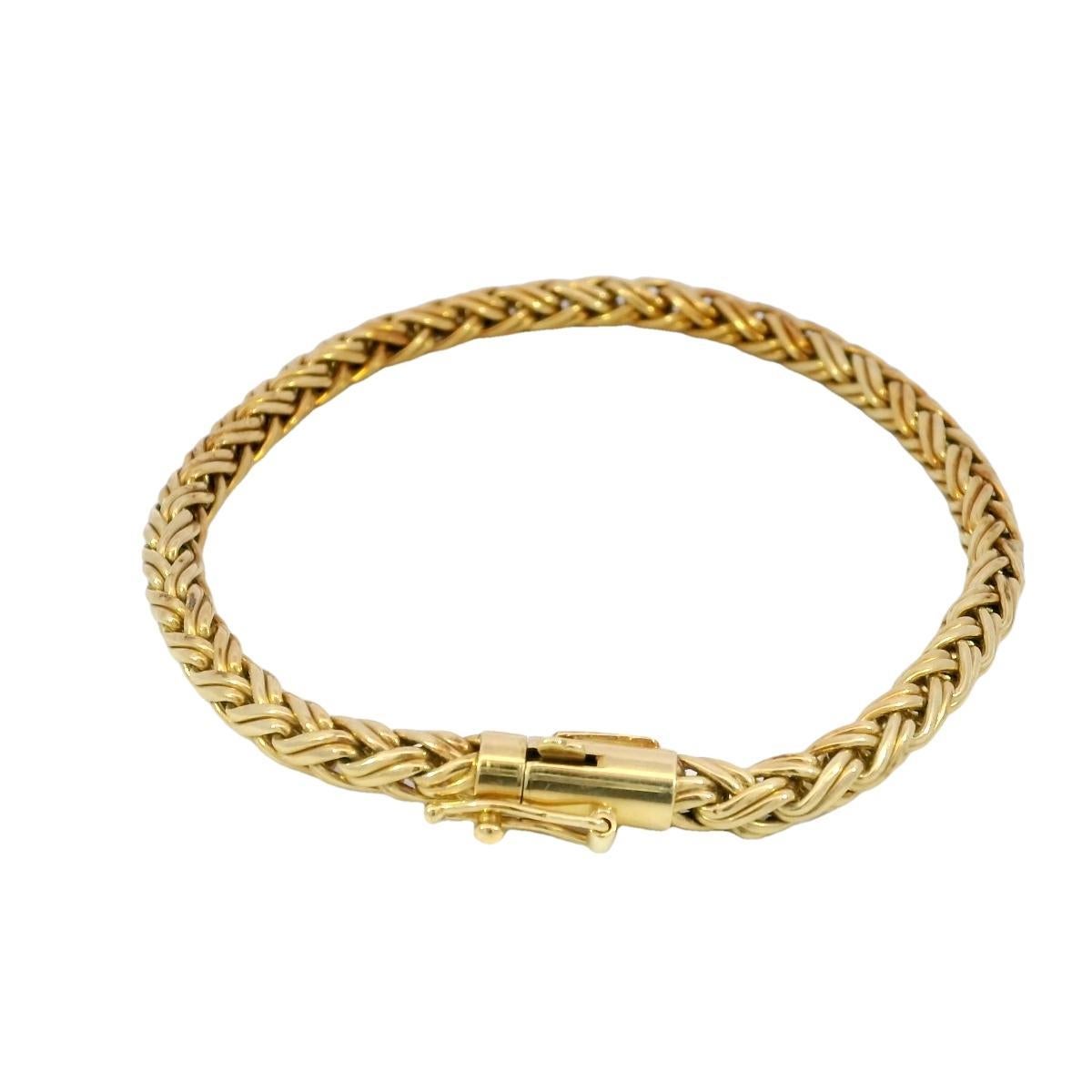 Tiffany & Co. Braided 18K Gold Bracelet

A masterpiece of craftsmanship and design, this Tiffany & Co. bracelet is the epitome of understated luxury. Woven from radiant 18K yellow gold, its intricate braid forms a seamless, flowing pattern that