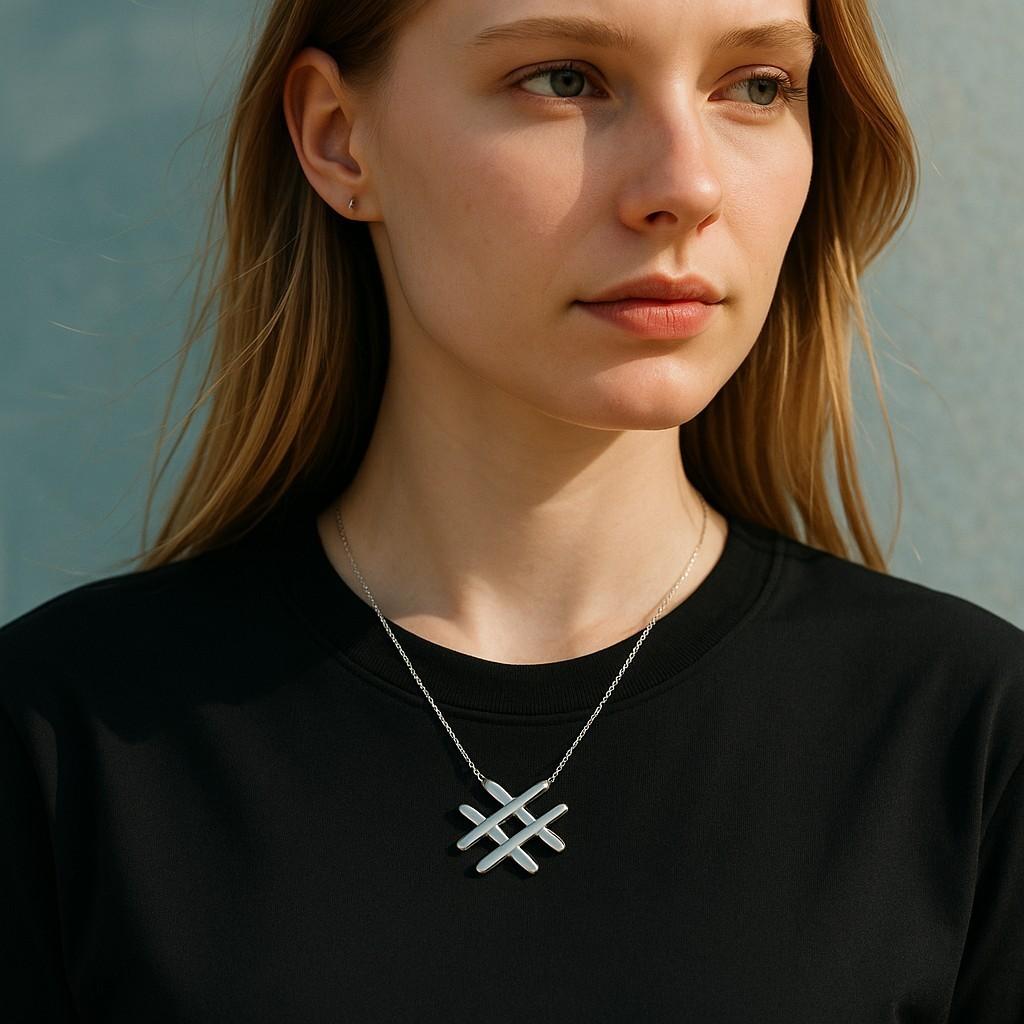 A Contemporary Symbol of Style and Connection

Elevate your jewelry collection with this stunning Tiffany & Co. 18K Yellow Gold Hashtag Pendant Necklace. Meticulously handcrafted in Italy, this piece combines modern design with the timeless elegance