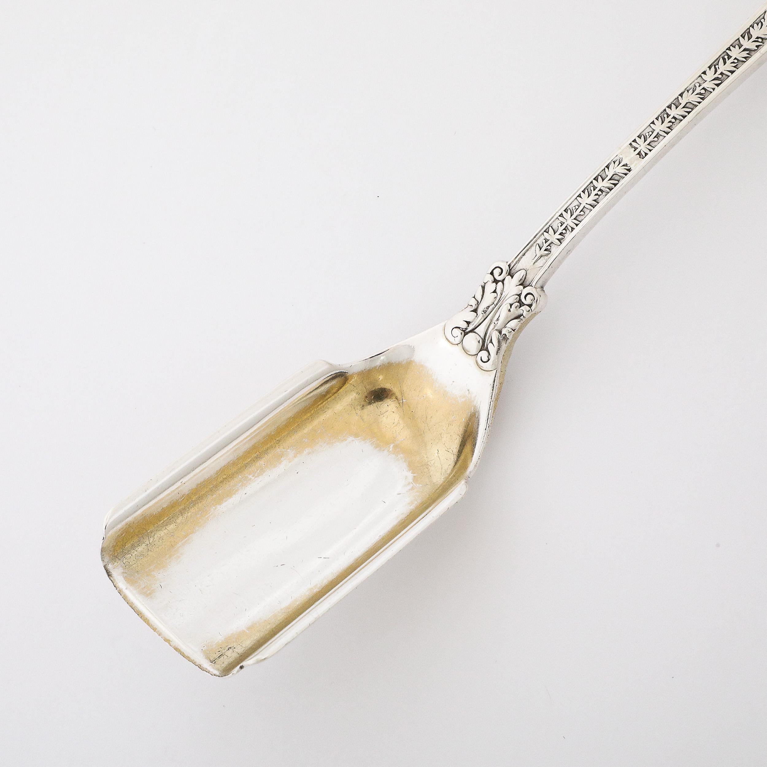American Tiffany and Co. 19th Century Sterling and Gold Serving Spoon in Olympian Pattern