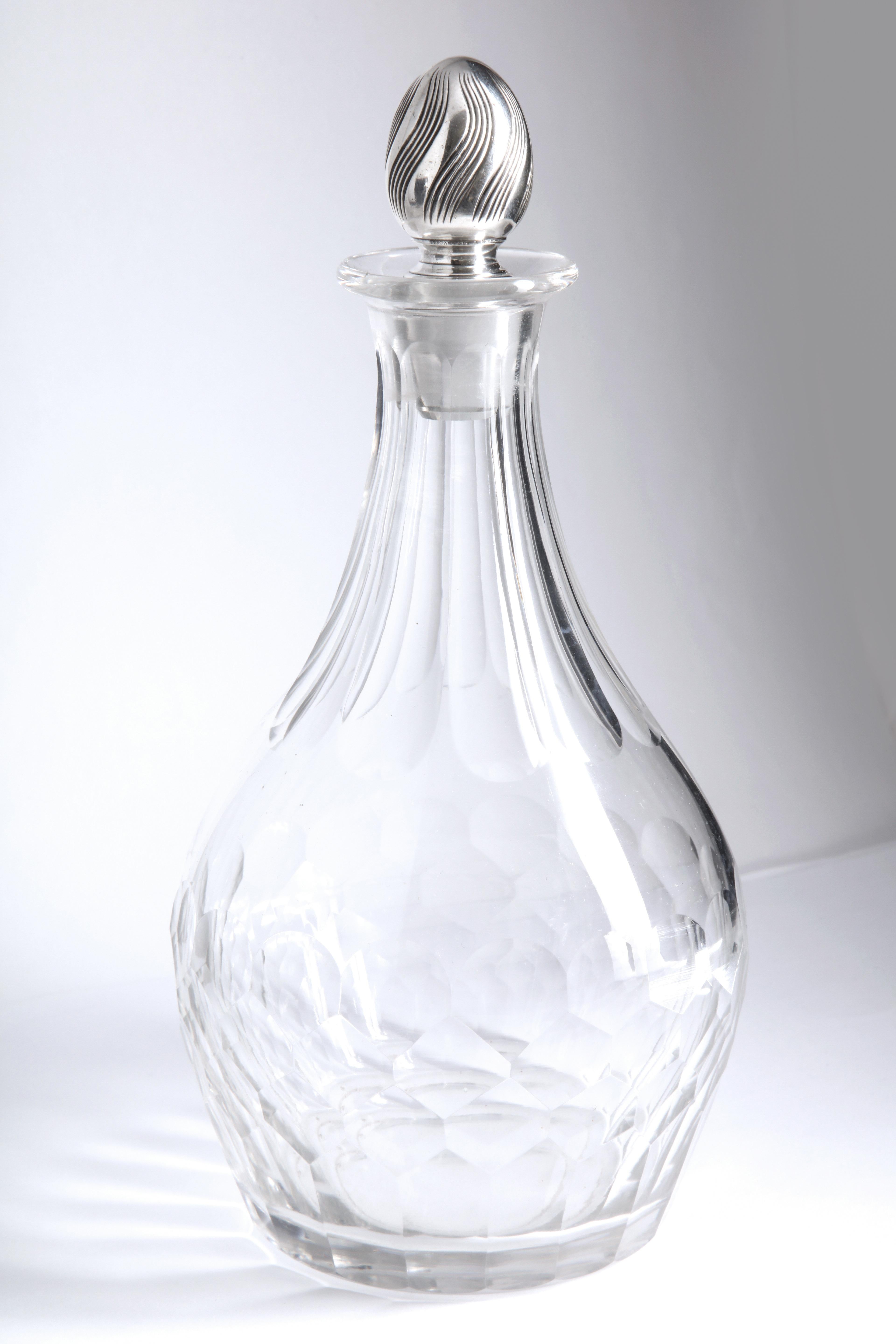 Art Nouveau, sterling silver-mounted, thumb-print design decanter by Tiffany and Co., New York, mark used between 1875-91. Stands 9 3/4 inches high (with stopper) x 4 3/4 inches diameter at widest point. One very, very minor unnoticeable nick on