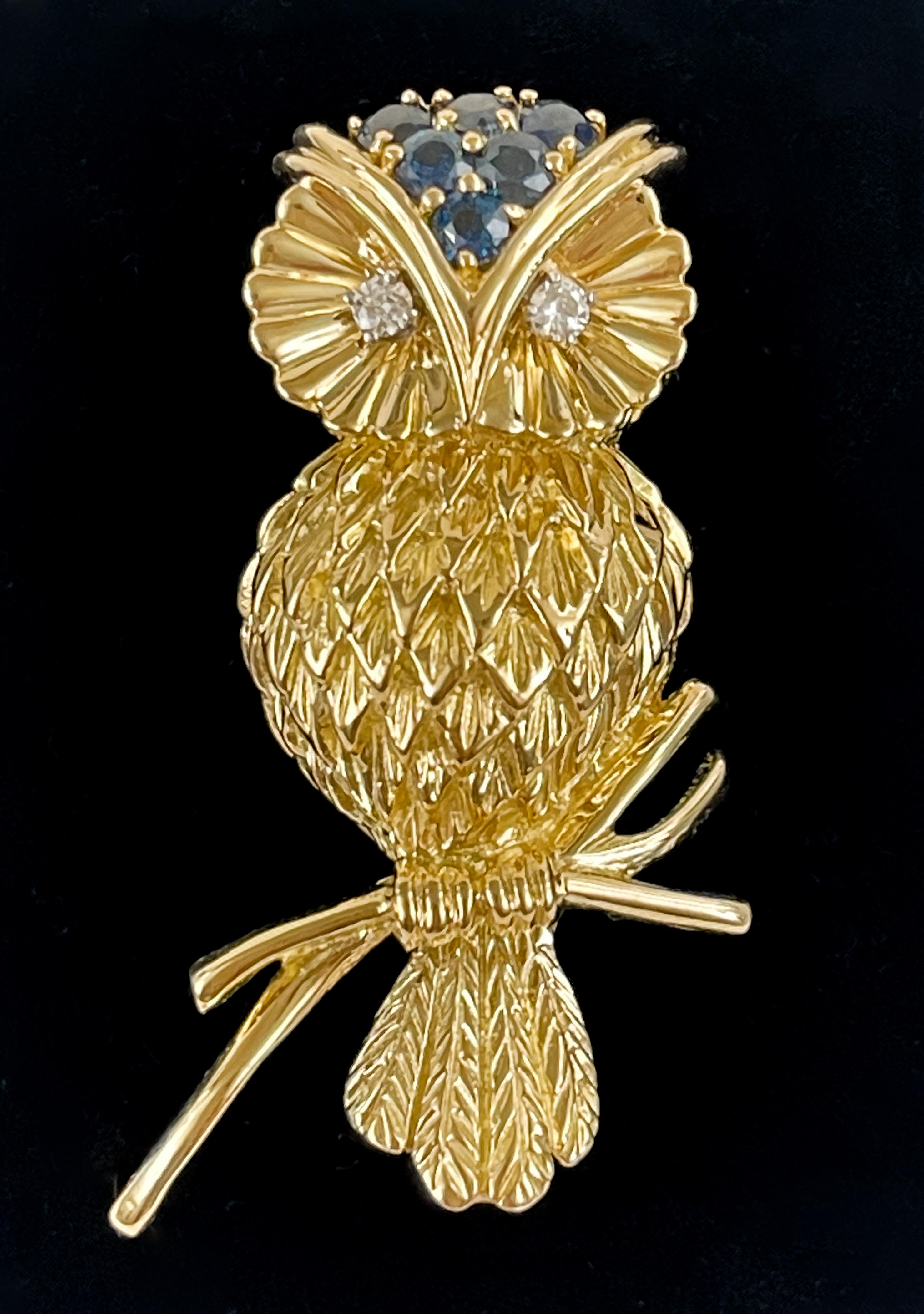 This stunning vintage Tiffany & Co. 18K Diamond and Blue Sapphire Owl Brooch is sure to stand out. With exquisite detail and stones checked and cleaned by specialists at Tiffany, this beautiful piece is a must-have for any jewelry