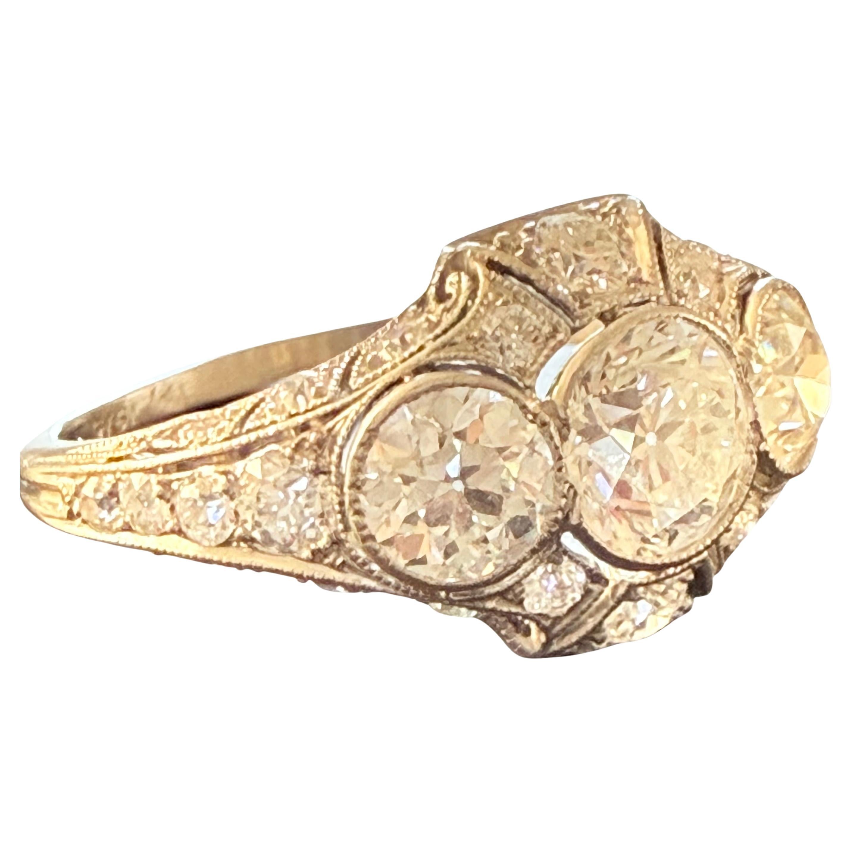 Tiffany & Co 
A beautiful bright-white and sparkling European-cut diamond, weighing 2.40 cts TOTAL Elegantly presented in classic Art Deco fashion in this Jazz Age jewel, expertly hand fabricated in platinum - circa 1925. The center stone is