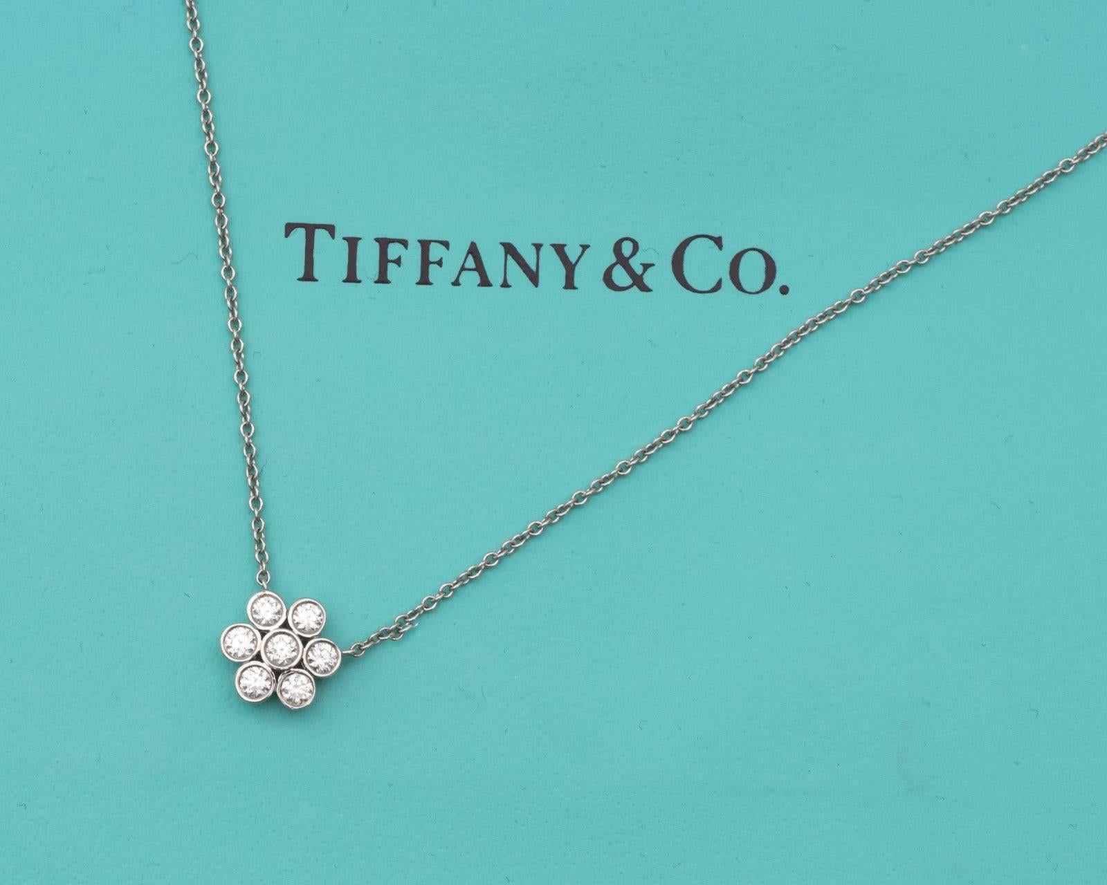 Tiffany and Co. Enchant Flower Pendant crafted in Platinum and Diamonds

This 0.60 carat total weight diamond necklace was originally part of the Tiffany & Co. Enchant collection. 
The seven diamonds sparkle and shine! This 16 inch necklace is ideal