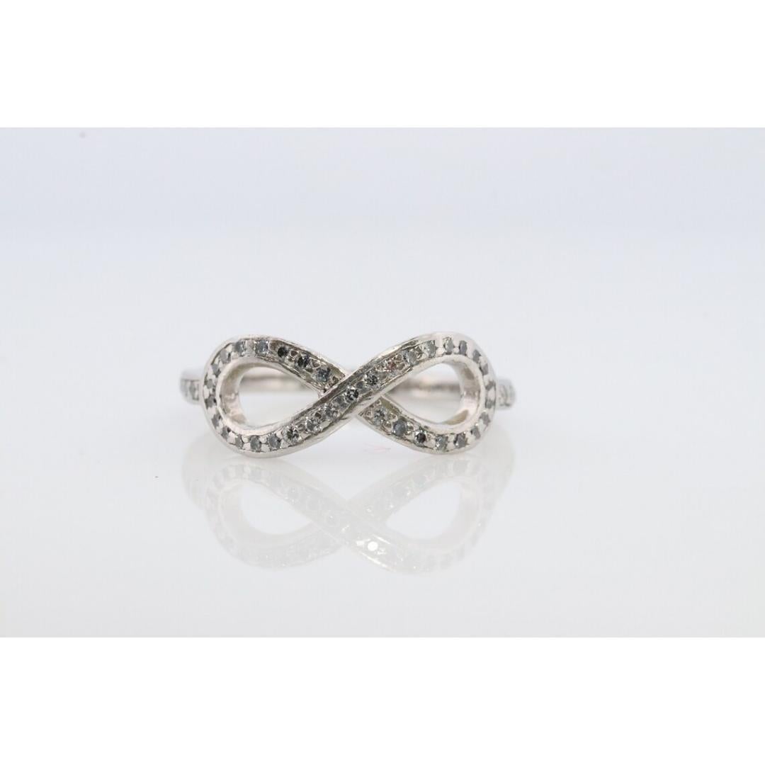 Tiffany and Co. Diamond Ring. Platinum Infinity Diamond Band. Infinity Loop In Good Condition For Sale In Port Charlotte, FL