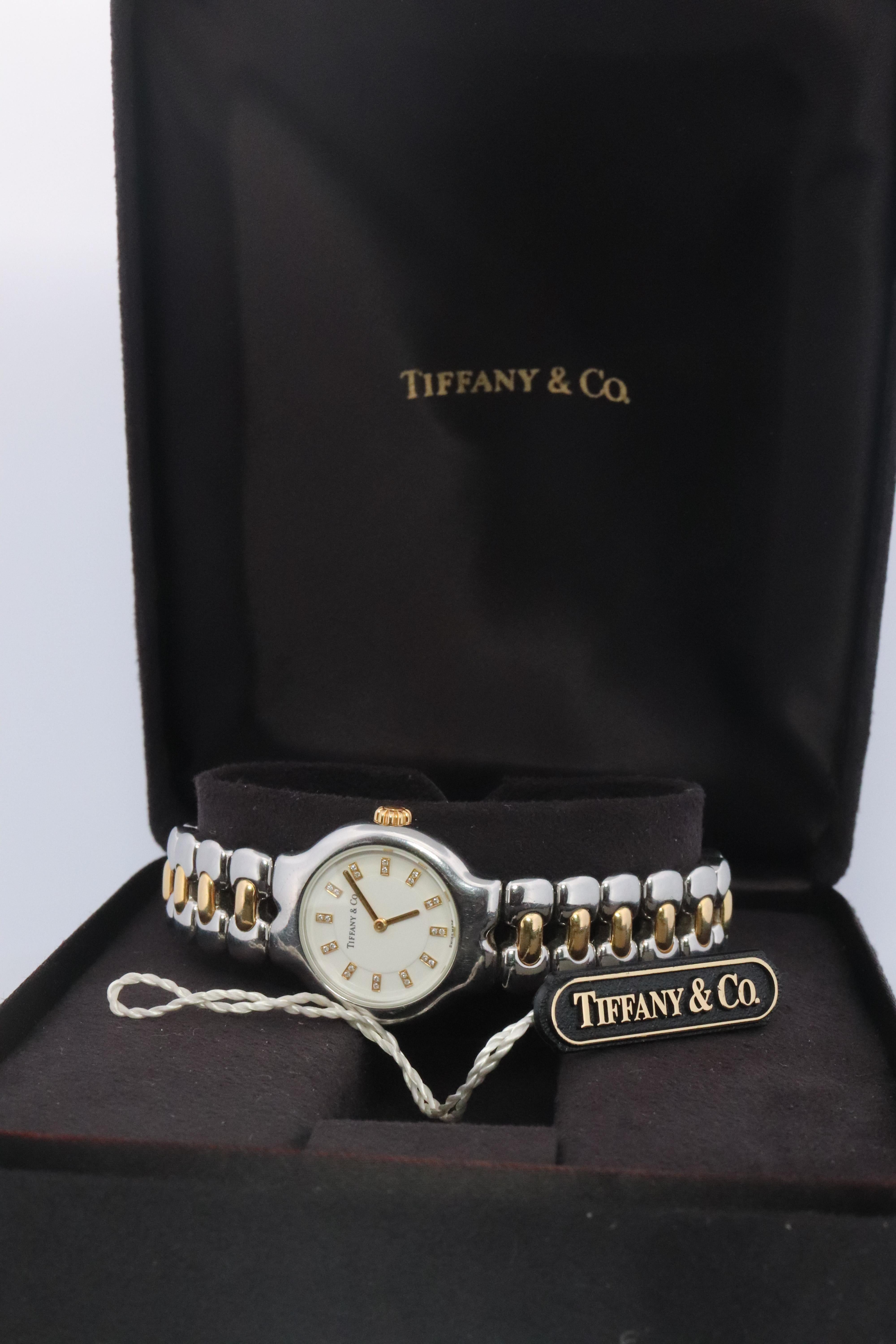 RARE Tiffany and Co Tessoro Watch
L0112

RARE DIAMOND DIAL

18k Gold with Stainless Steel
25mm case

Beautiful Watch. Quartz. Works and keeps time. New Battery installed.

Comes with original Tiffany Watch box.

Condition: Limited visible signs of