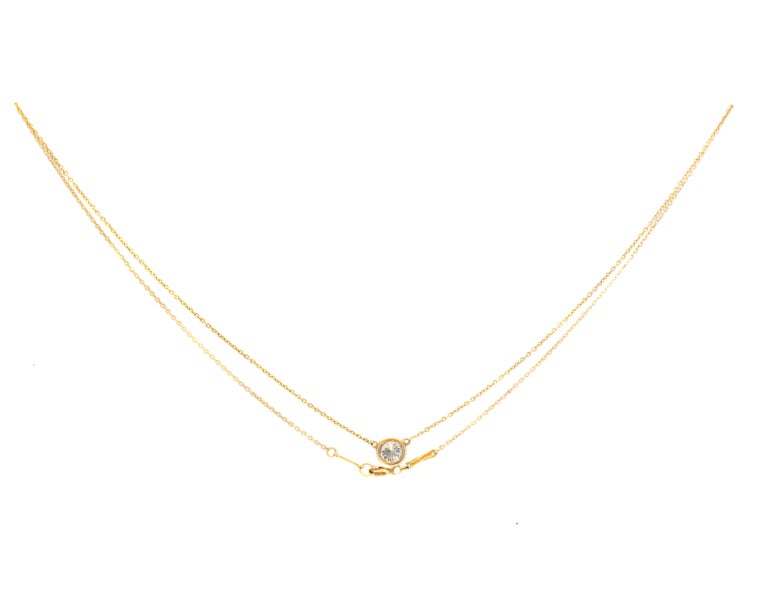 Tiffany and Co. Diamond Pendant Necklace - 18 karat Yellow Gold, Diamond

Features:
From the Elsa Peretti Diamonds by the Yard Collection
6.5 millimeter Round Brilliant Diamond
0.50 carat Round Brilliant Diamond
18 karat Yellow Gold
Spring Ring