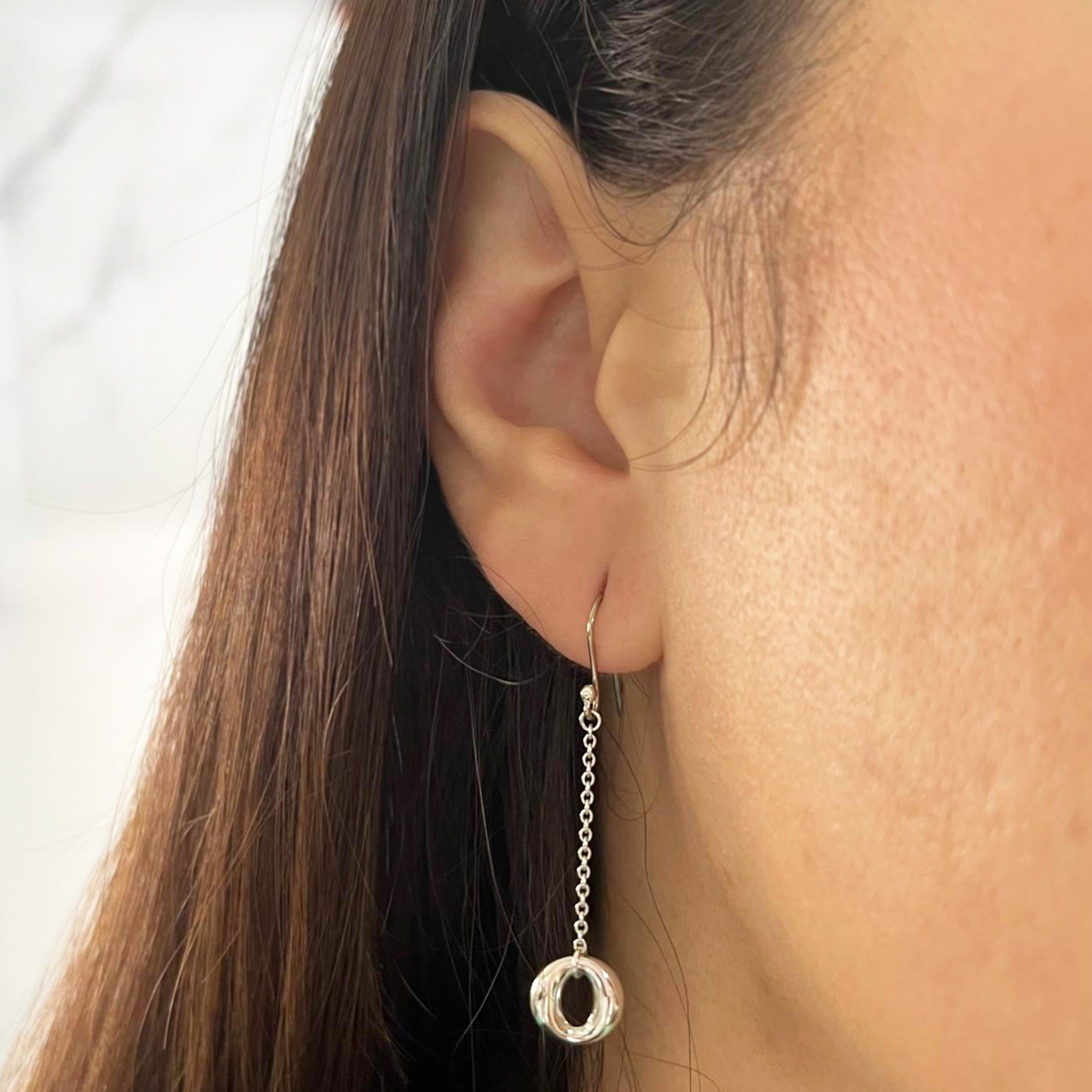 Tiffany and Co. by Elsa Peretti Sevillana dangle earrings featuring shepherd's hook design. 2 inches long. $550 MSRP.